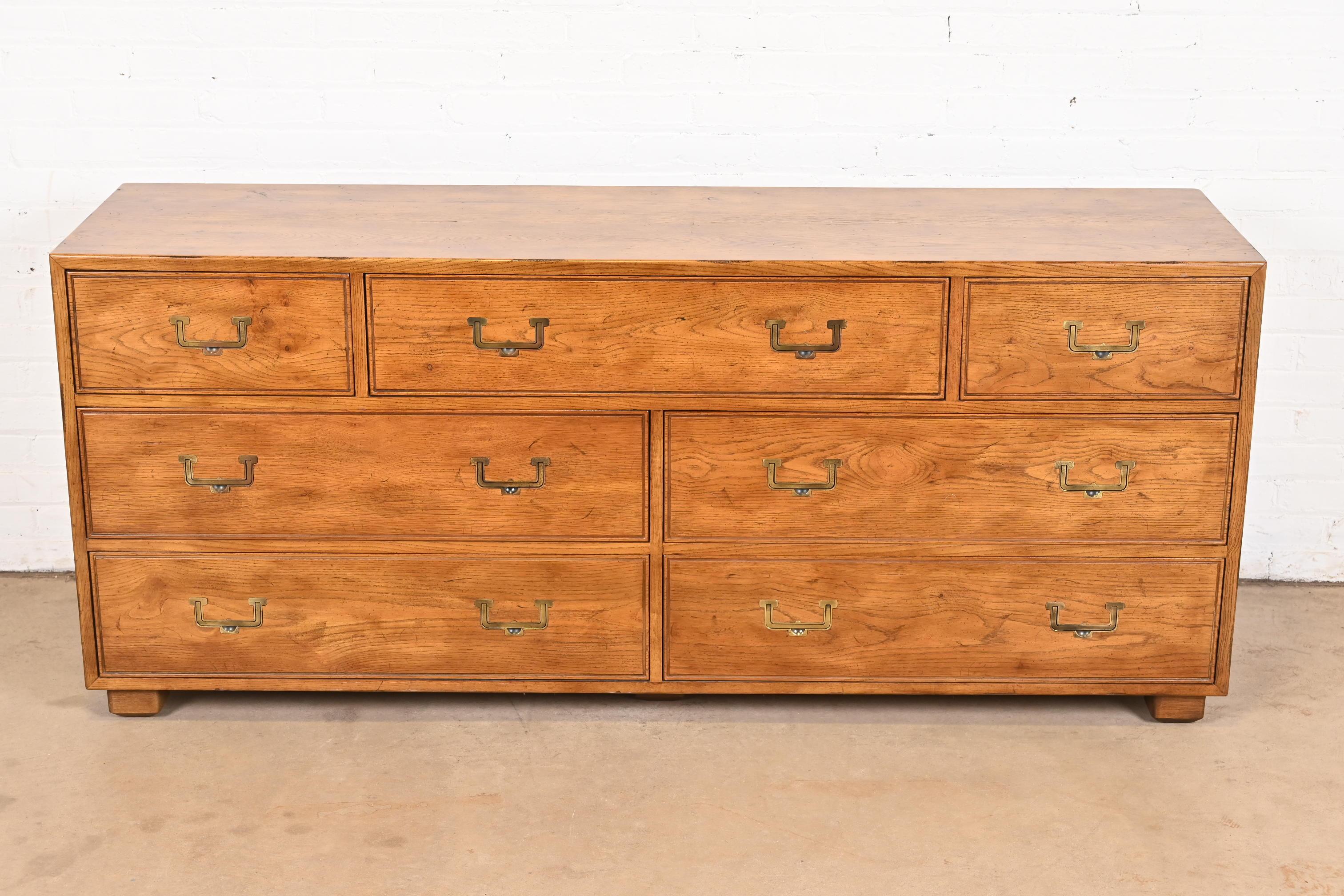 A gorgeous Mid-Century Modern Campaign style seven-drawer dresser or credenza

By Henredon, 