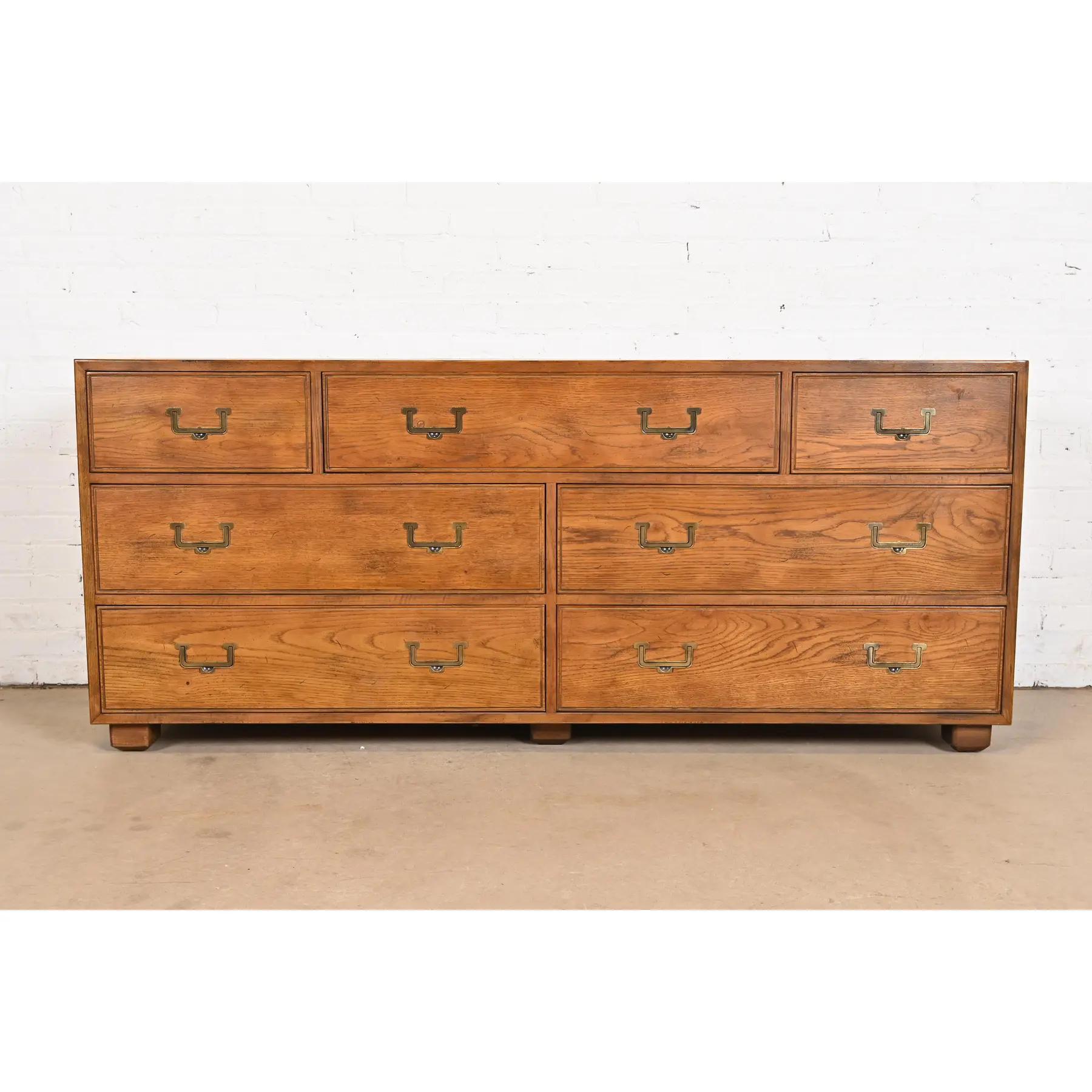 A gorgeous Mid-Century Modern Campaign style seven-drawer dresser or credenza

By Henredon, 