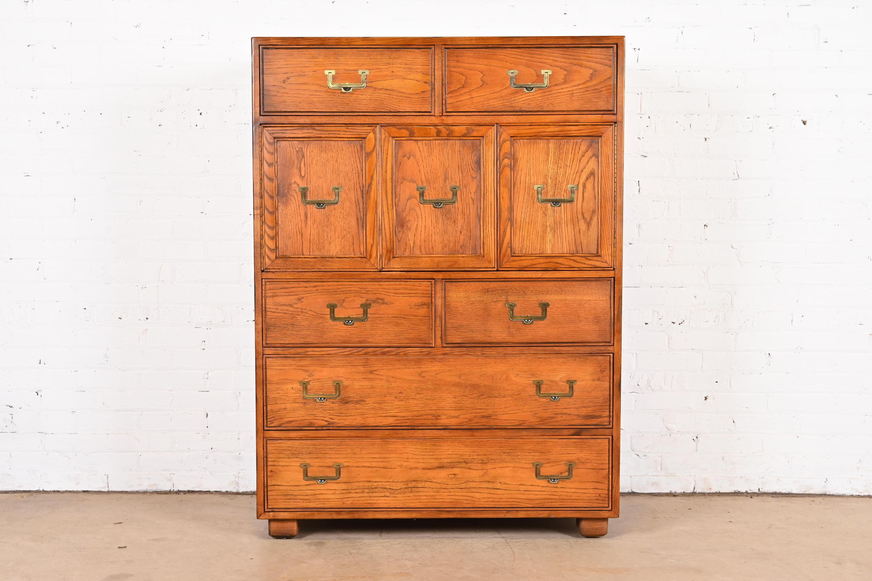 A gorgeous Mid-Century Modern Campaign style highboy dresser or gentleman's chest

By Henredon, 