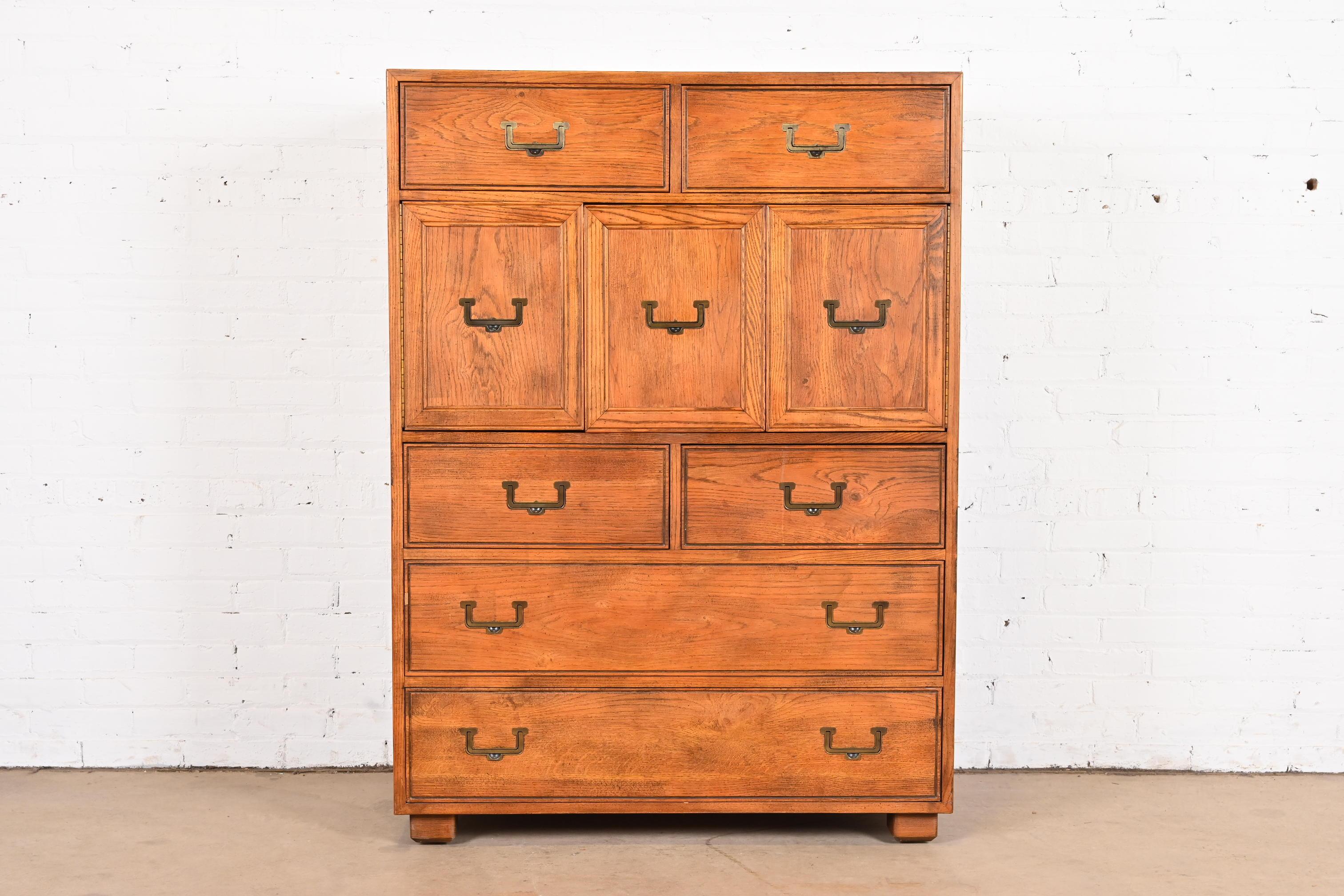 A gorgeous Mid-Century Modern Campaign style six-drawer highboy dresser or gentleman's chest

By Henredon, 