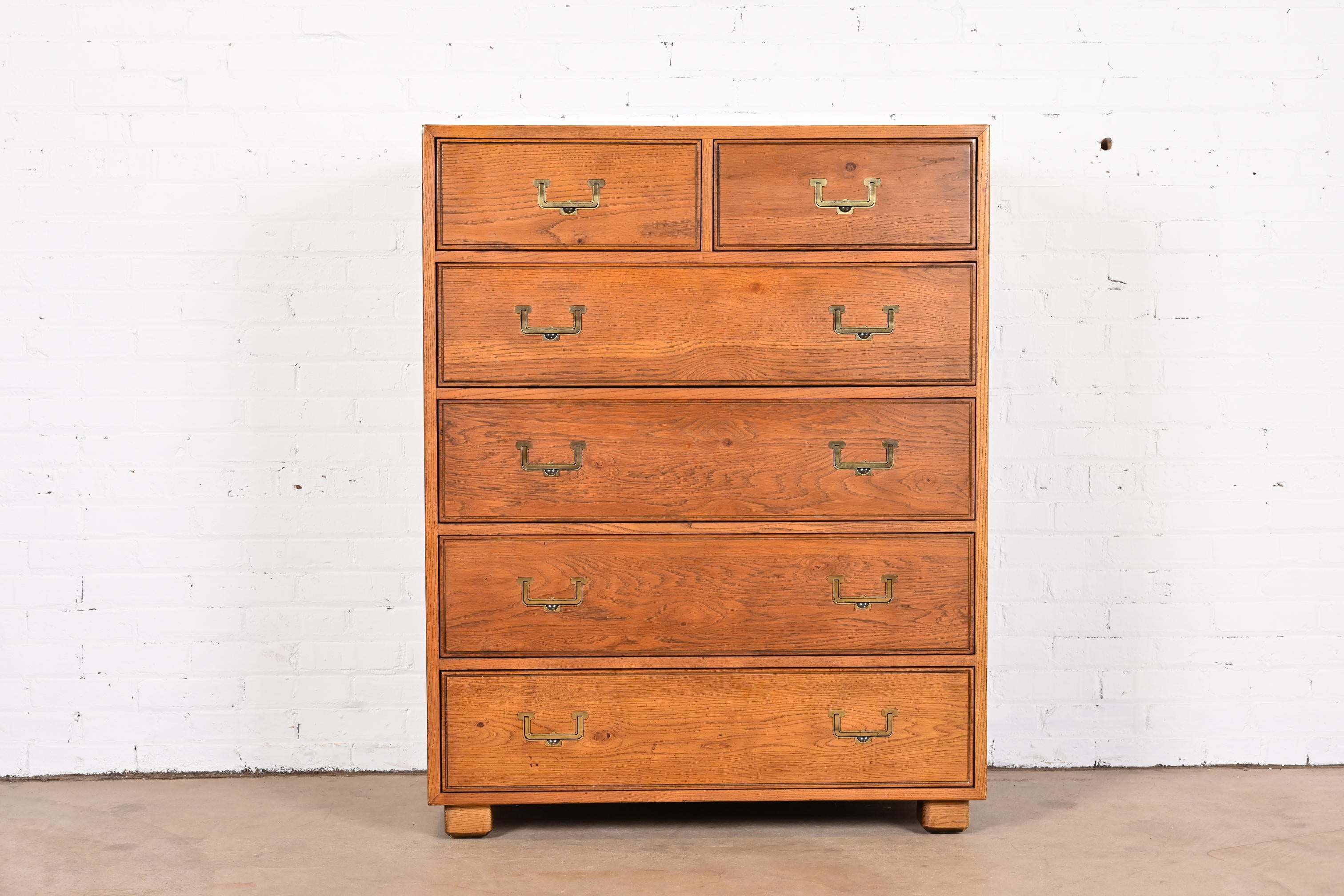 A gorgeous Mid-Century Modern Campaign style six-drawer highboy dresser

By Henredon, 