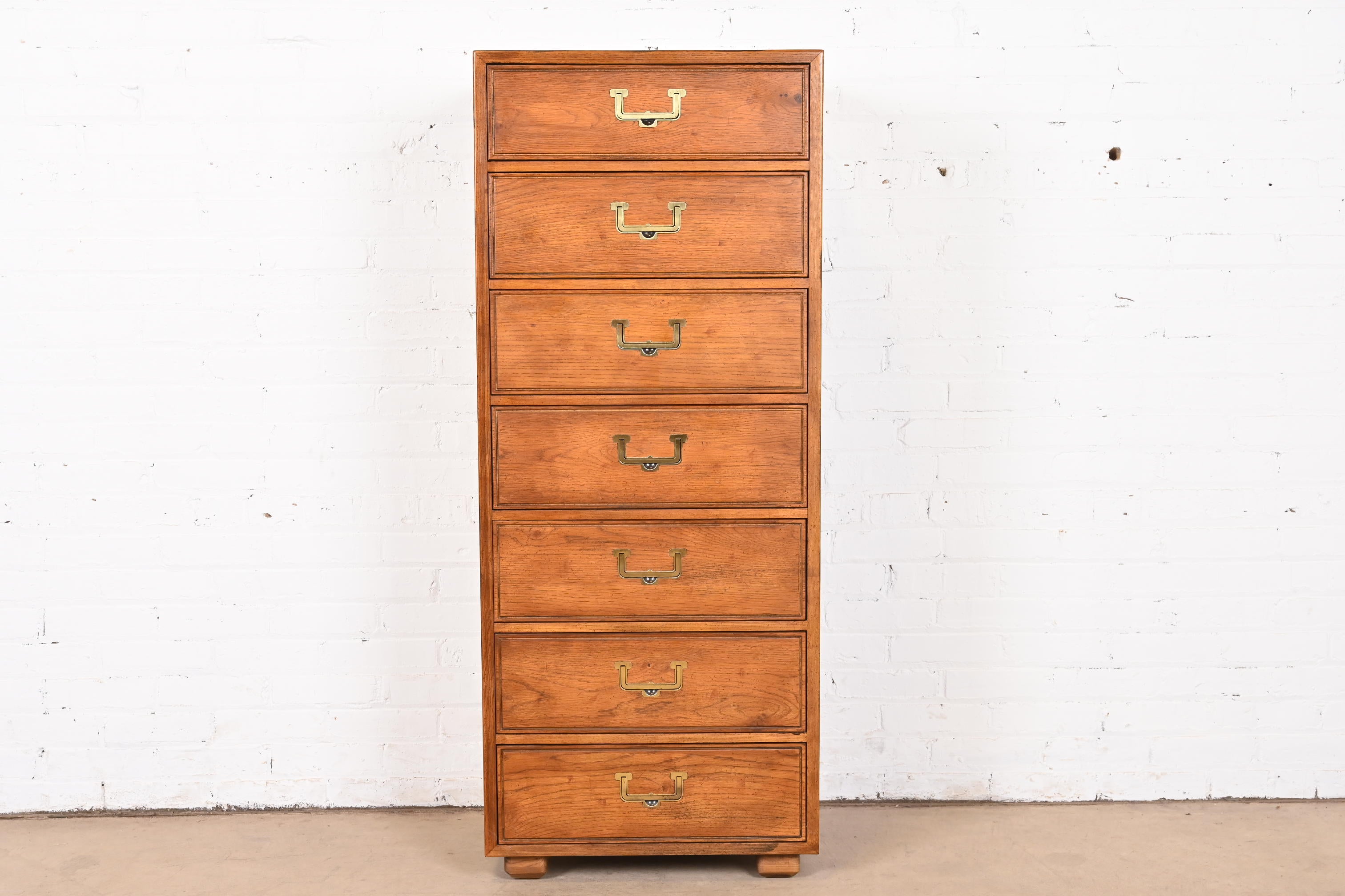 A gorgeous Mid-Century Modern Campaign style highboy dresser or lingerie chest

By Henredon, 