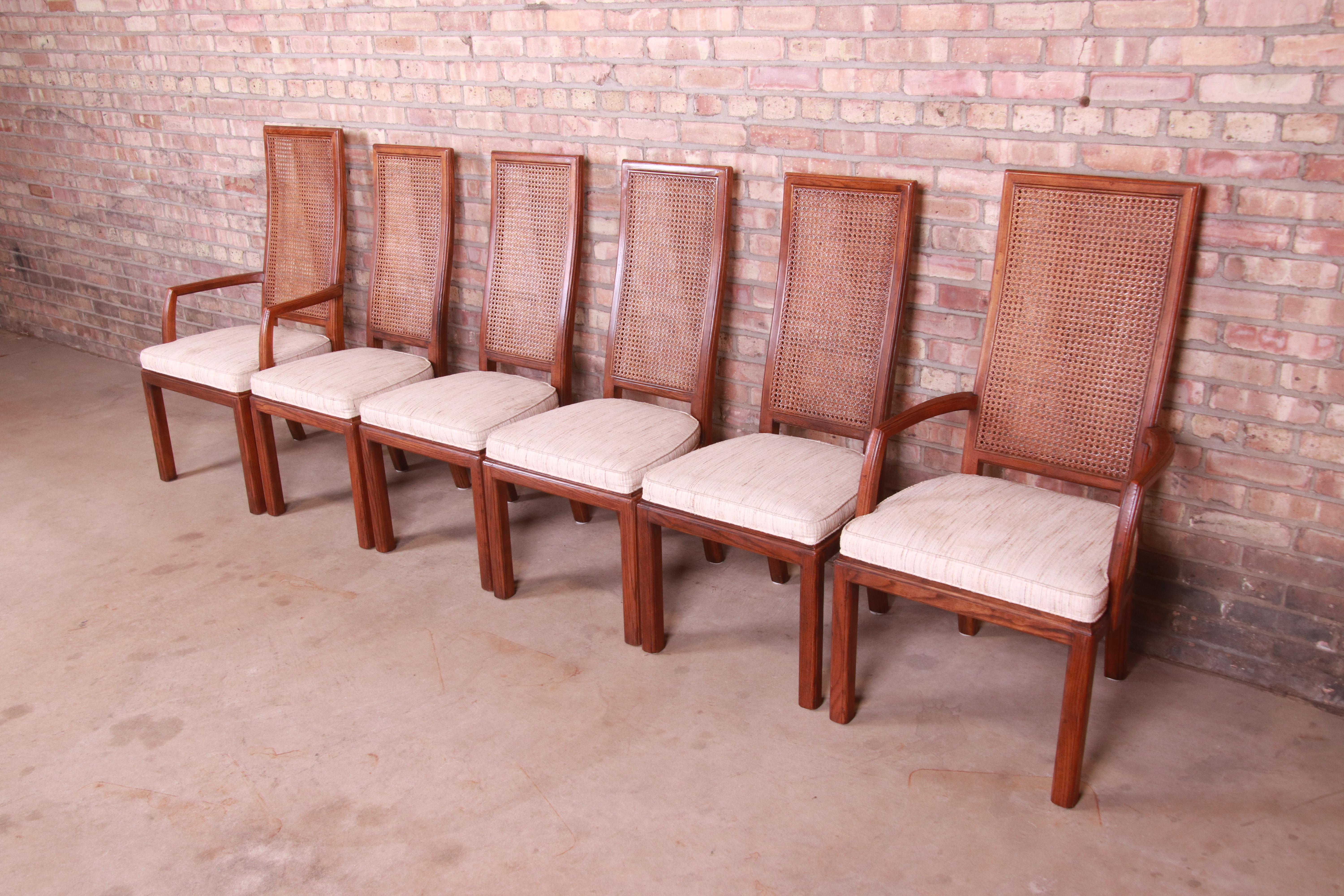 A gorgeous set of six Mid-Century Modern high back dining chairs

By Henredon

USA, Circa 1970s

Oak frames, with cane backs and upholstered seats.

Measures:
Side chairs: 19.25
