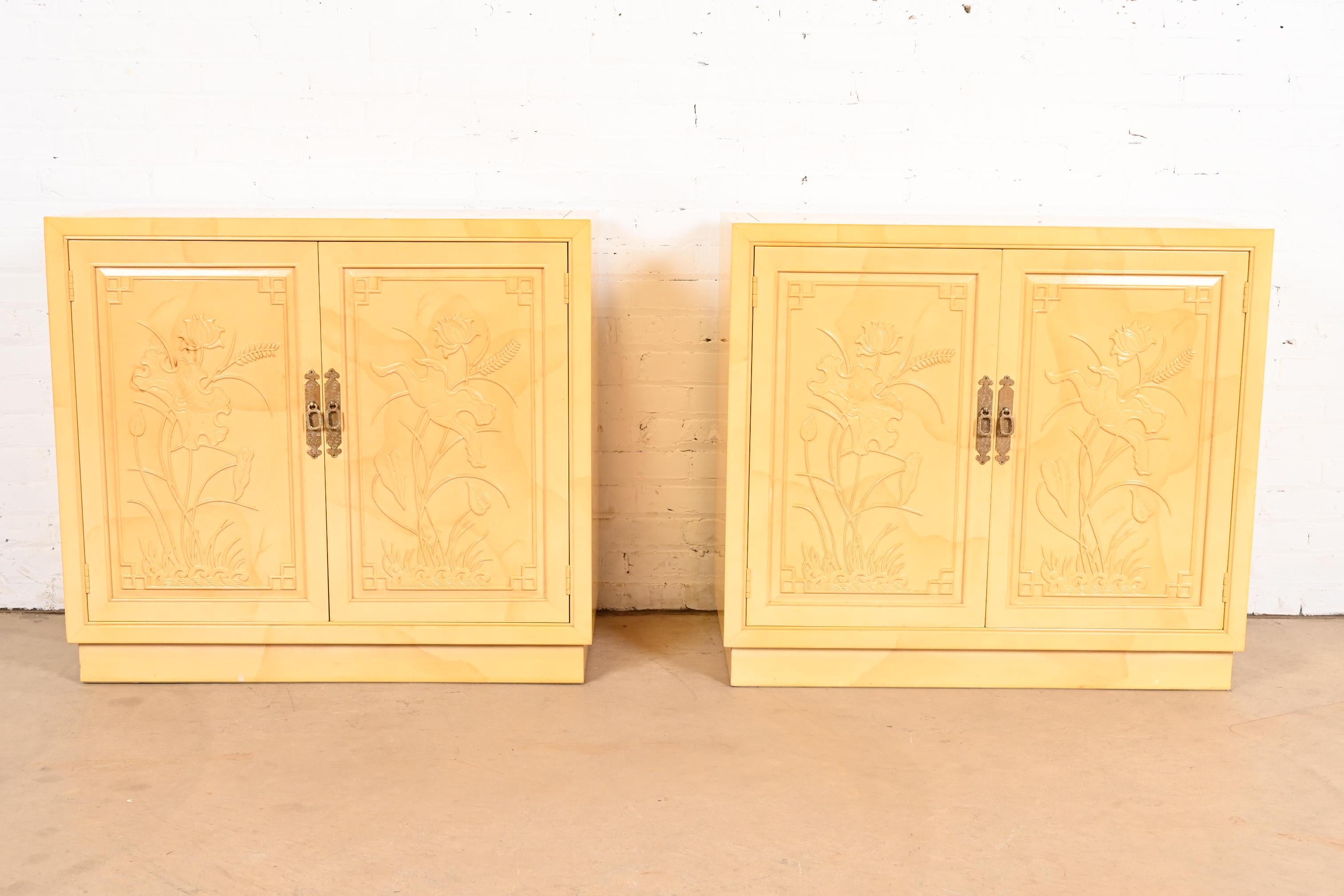 A gorgeous pair of mid-century modern Hollywood Regency Chinoiserie bar cabinets, buffet servers, or record cabinets

By Henredon

USA, Circa 1970s

Carved cream lacquered faux goatskin cases, with original brass hardware. Shelves are