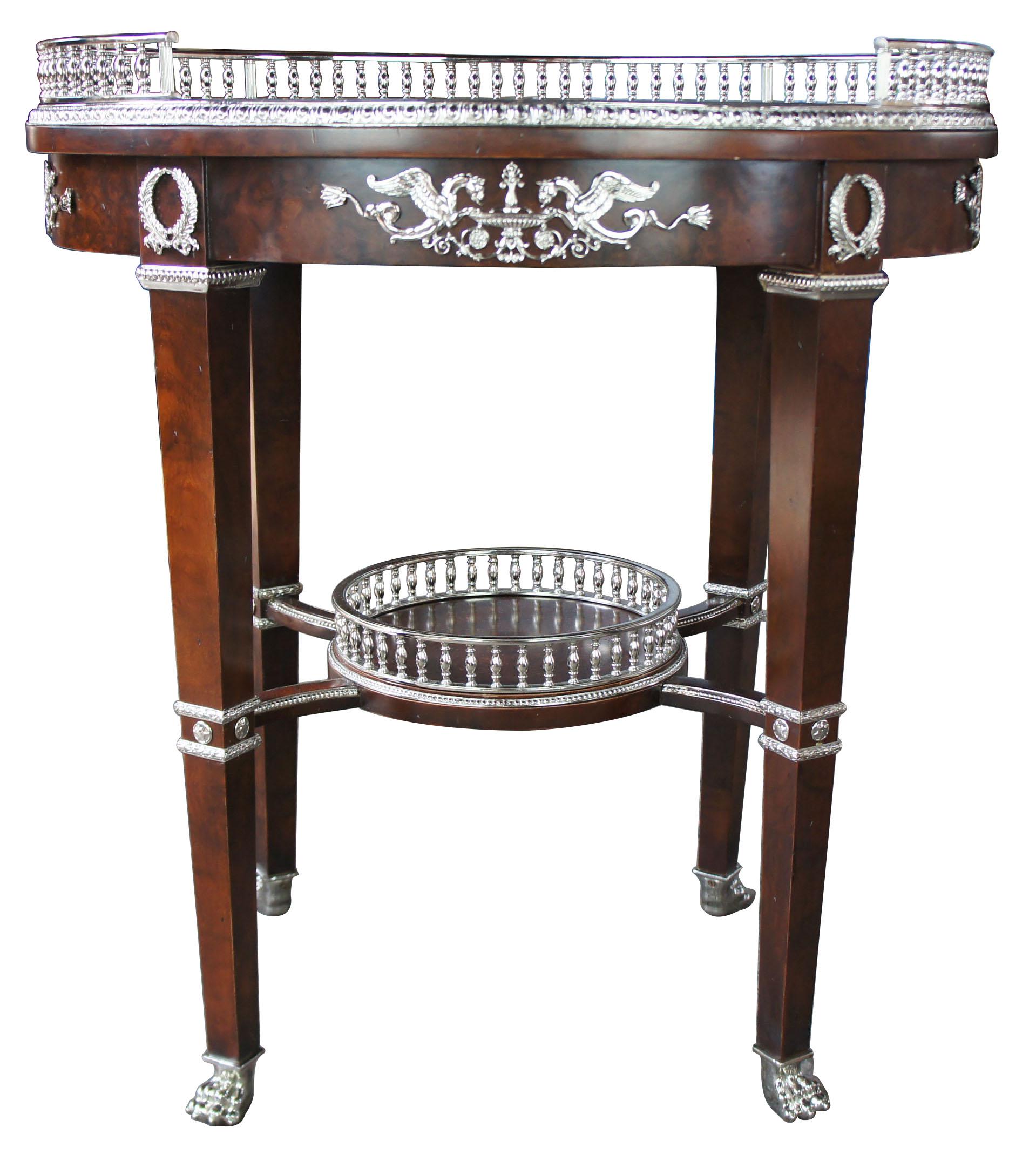 Henredon neoclassical Revival burl wood bar cart accent table paw foot silver

An absolutely stunning handmade table by Henredon Furniture. Made from burl wood with silver mounts and galleries. Legs are tapered leading to claw feet. Marked