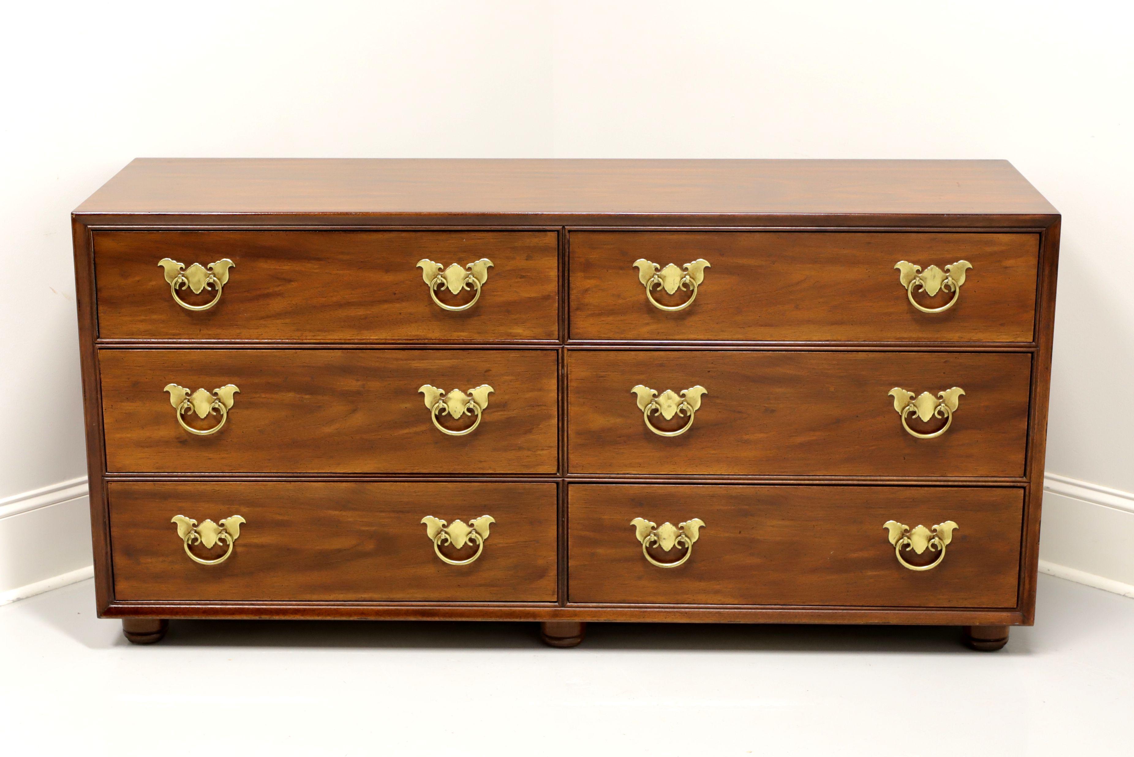 A Pan Asian style double dresser by Henredon. Walnut with brass hardware and bun feet. Features six large drawers of dovetail construction, three having removable dividers. Made in North Carolina, USA, circa 1970's.

Measures: 62 W 19 D 30.25