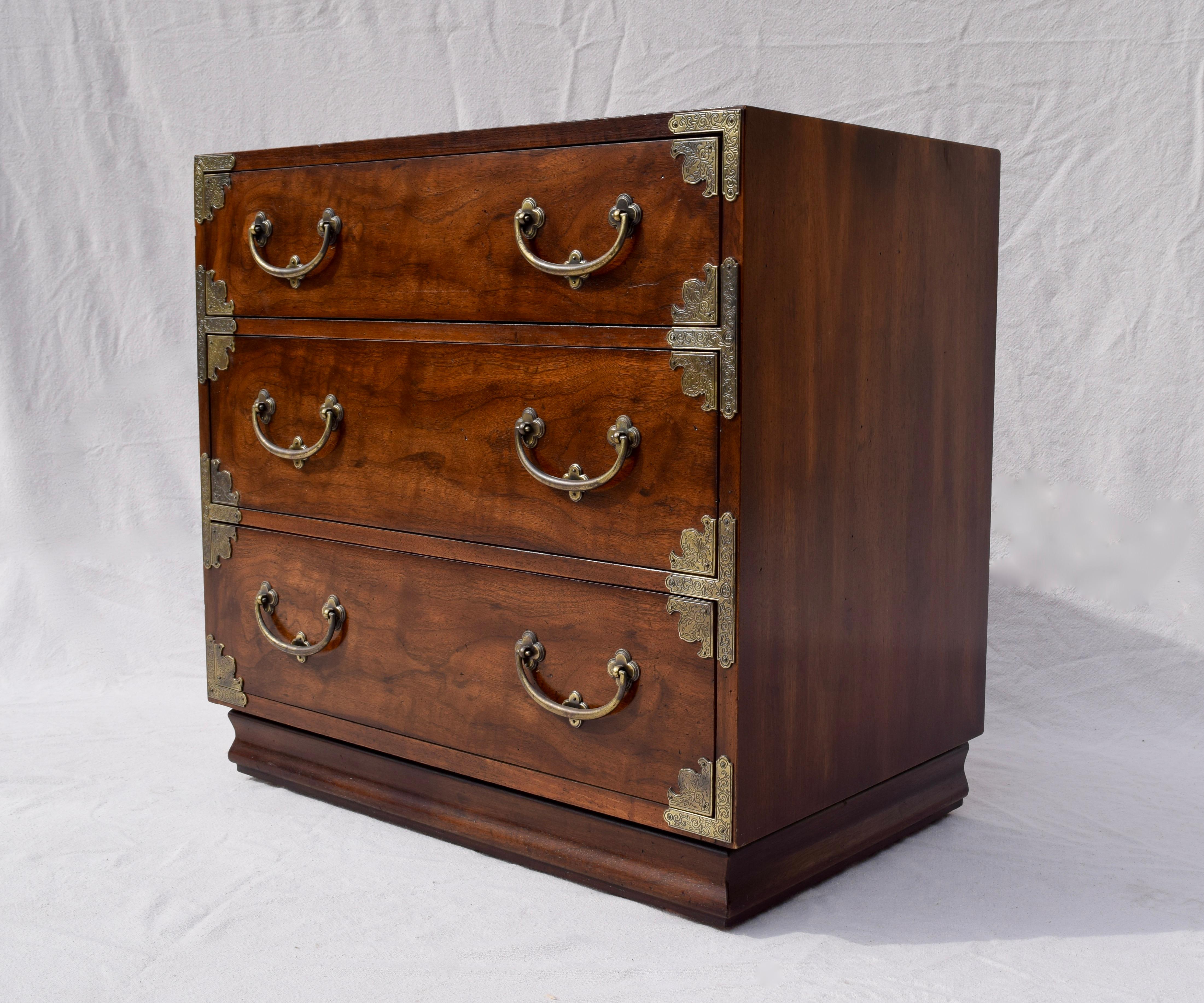 A bachelor chest in the Japanese Tansu style by Henredon of Morganton, North Carolina, USA. Made circa 1980. Mahogany with a rich brown finish. Brass hardware. Three dovetail drawers. Can be used as a bachelor chest or an oversized nightstand.