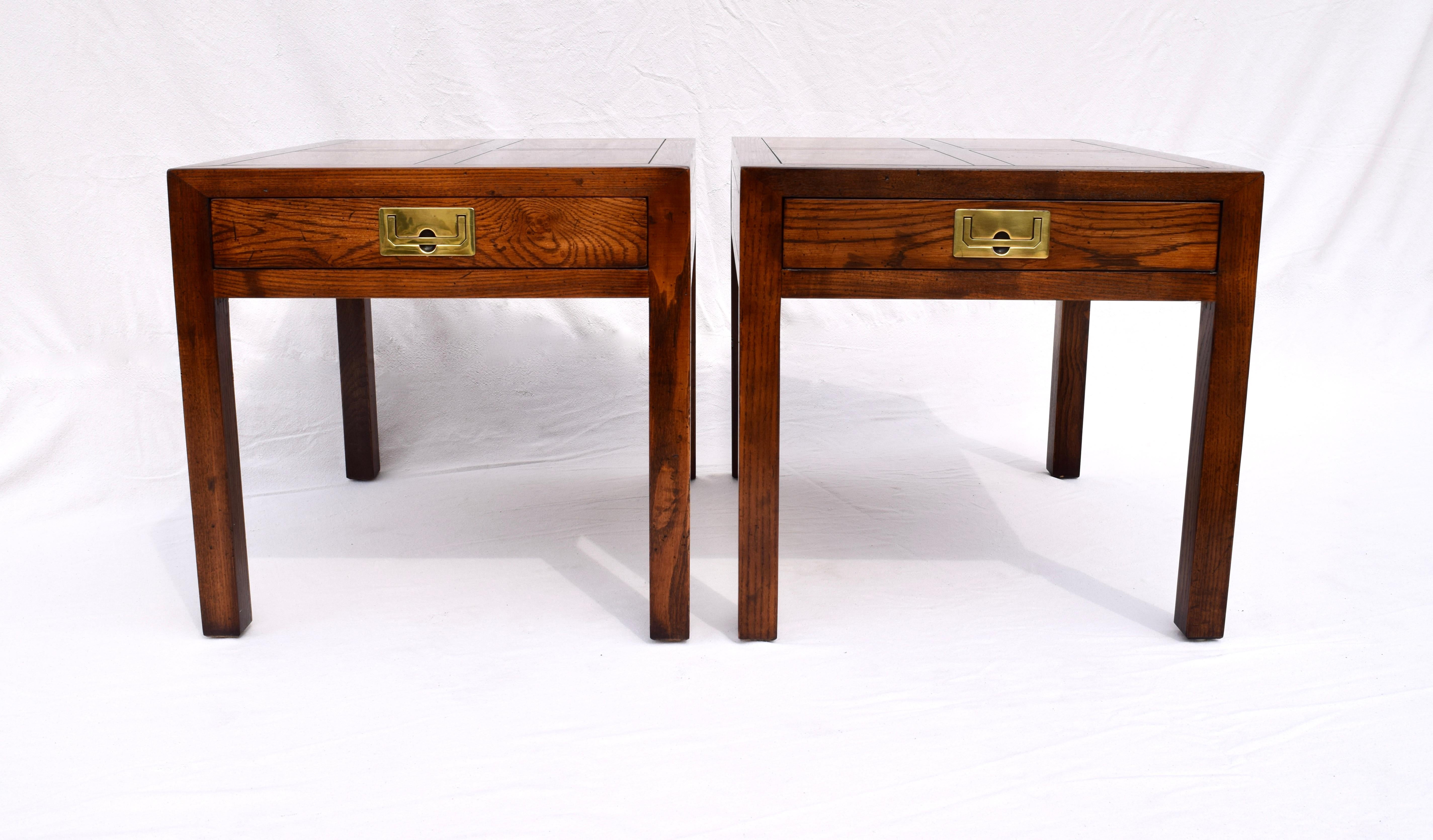 Classic Campaign styling from Henredon, pair of burl walnut Parsons side (or end) tables having a single recessed brass pull and striking parquetry tops.