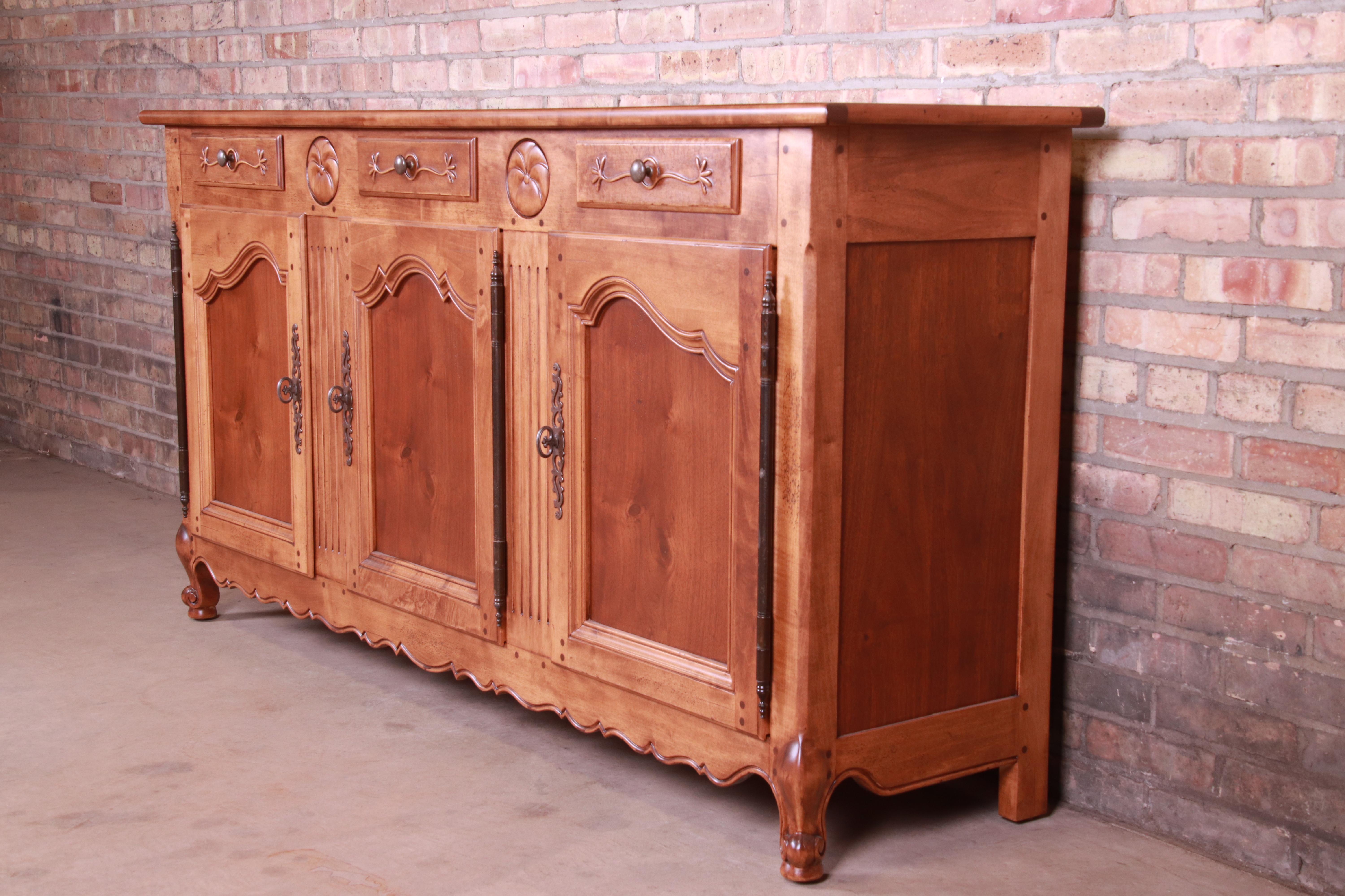 An exceptional French Provincial Louis XV style walnut sideboard 

By Henredon 