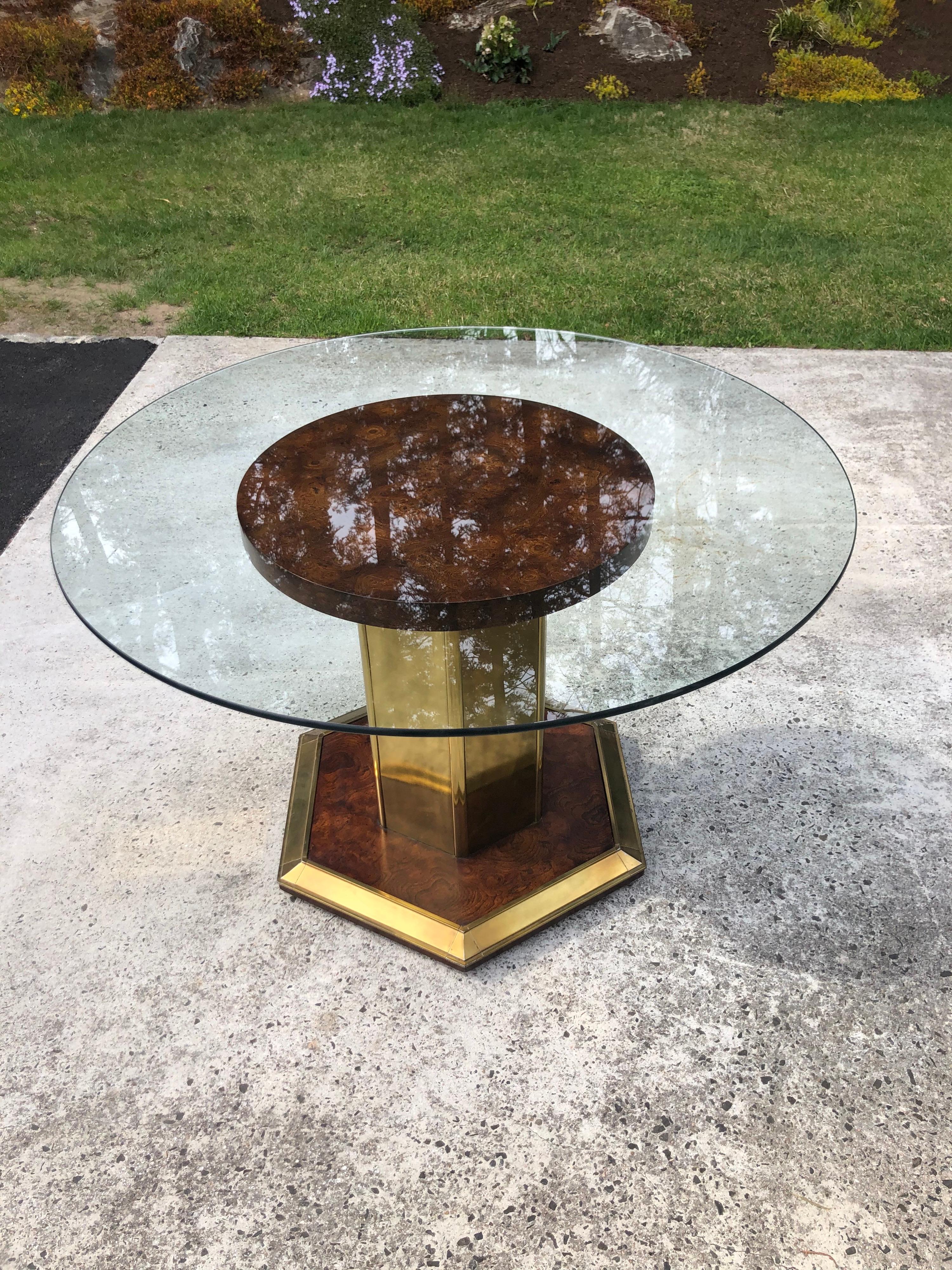 Henredon Style round burlwood dining table with round glass top.
Elegant and sophisticated this would fit in with mid century or Art Deco design.
 