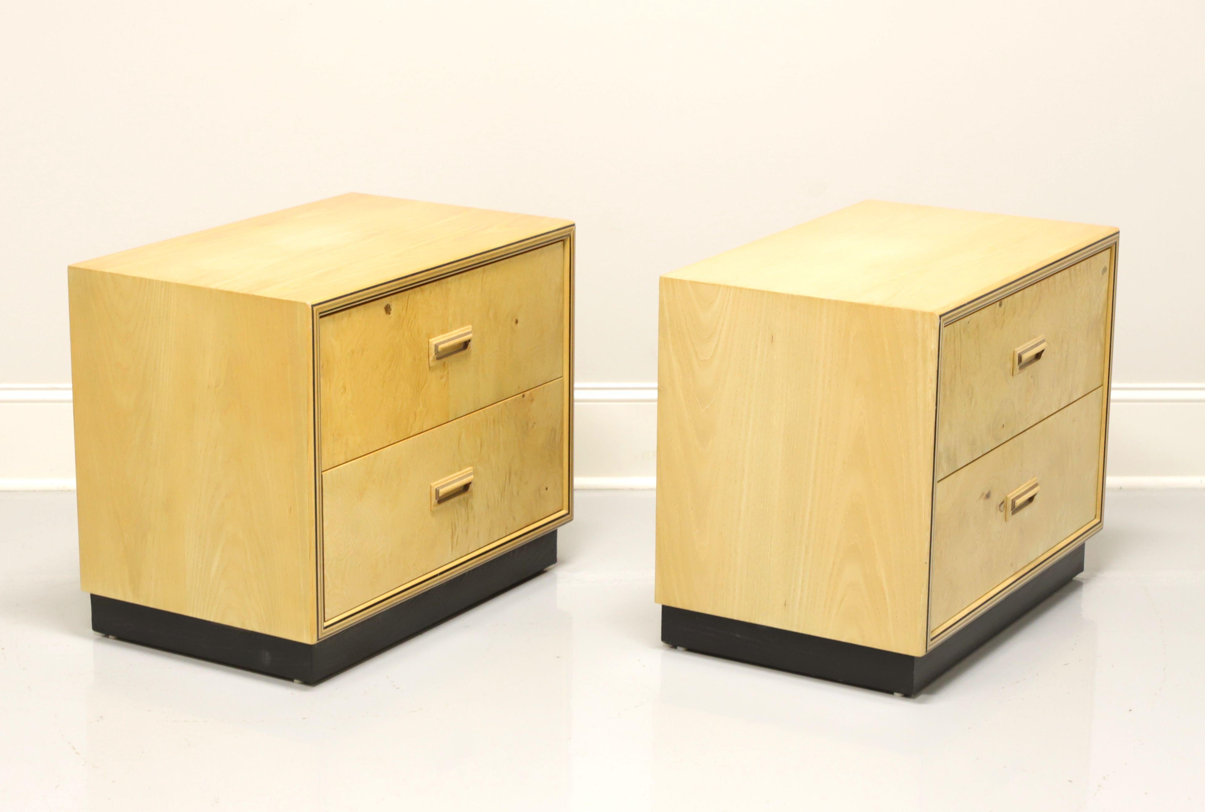 A pair of Art Deco style nightstands by Henredon, from their Scene Two Collection. Olive wood burl with decorative wood handles. Features two drawers of dovetail construction. Made in North Carolina, USA, circa 1980's.

Style #: 9601-06

Measures: