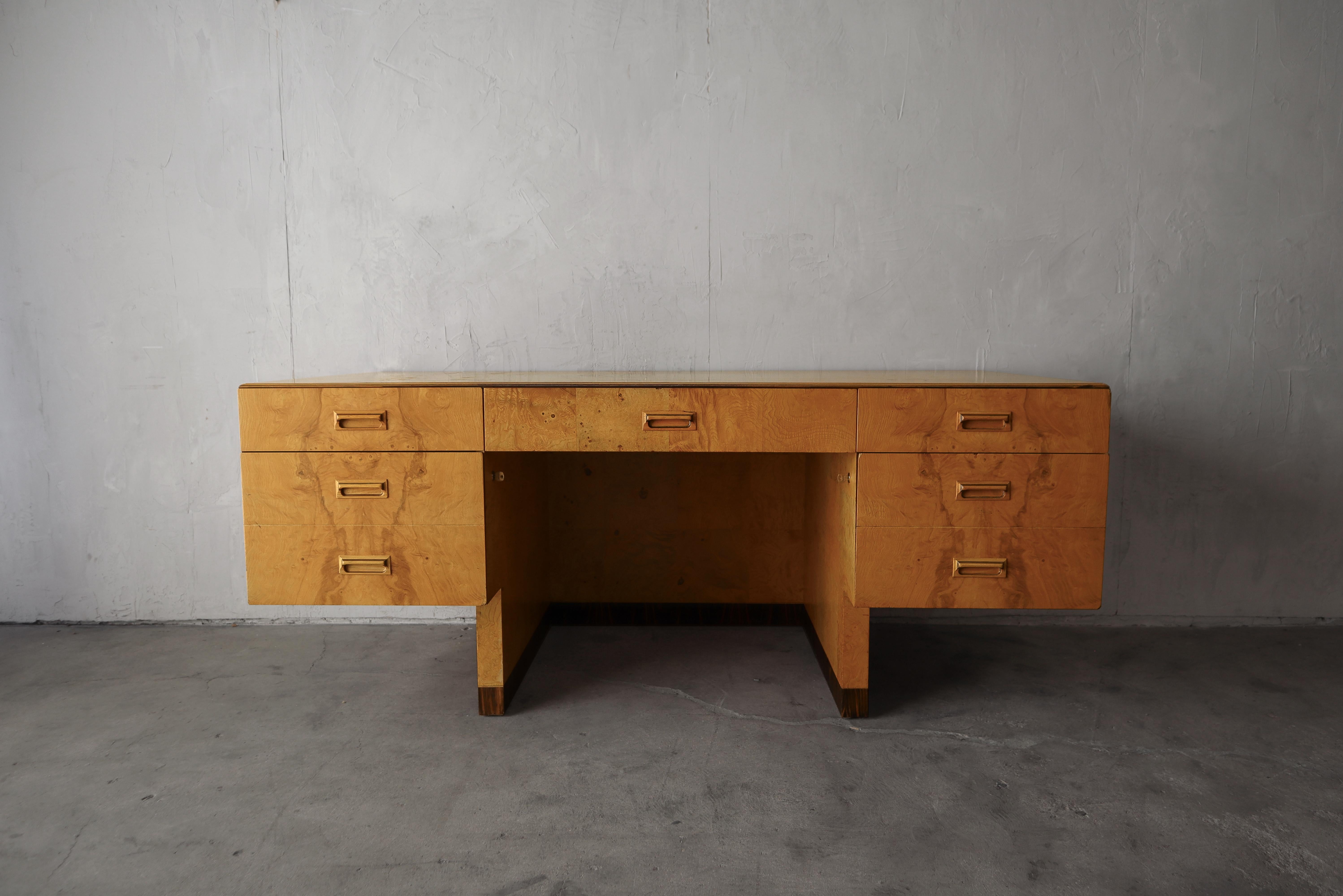 This is an exceptional Olive Wood Burl and Macassar Ebony Executive Desk from Henredon's Scene Two collection.  This desk features a beautiful book matched finish with the most amazing grain.  

The desk is in great vintage condition overall.  There