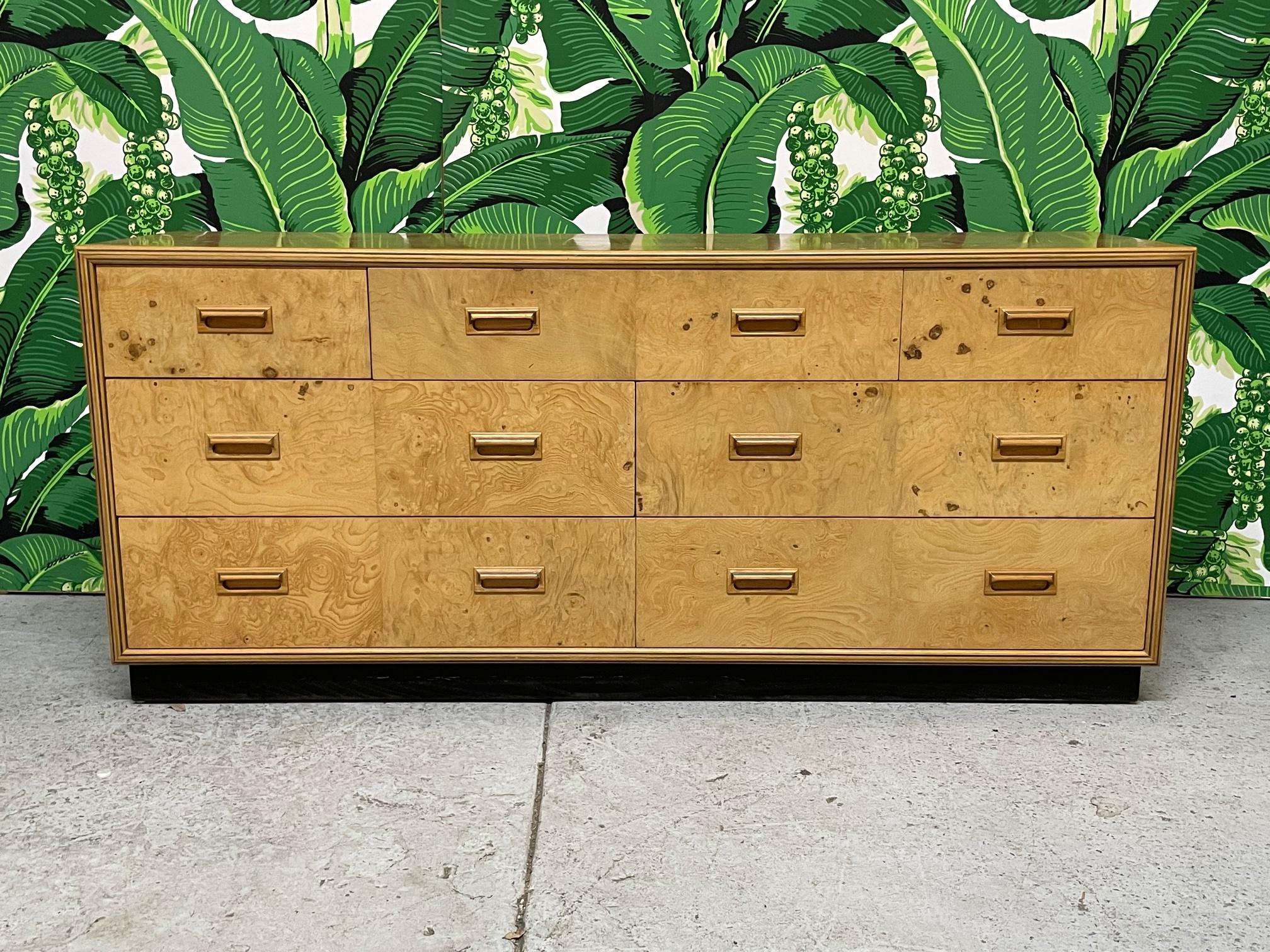 Burl wood dresser by Henredon from their Scene Two collection. Features 7 drawers, burl olive drawers and Macassar ebony Inlays, and inlaid sculpted wood pulls. Good condition with minor imperfections consistent with age.