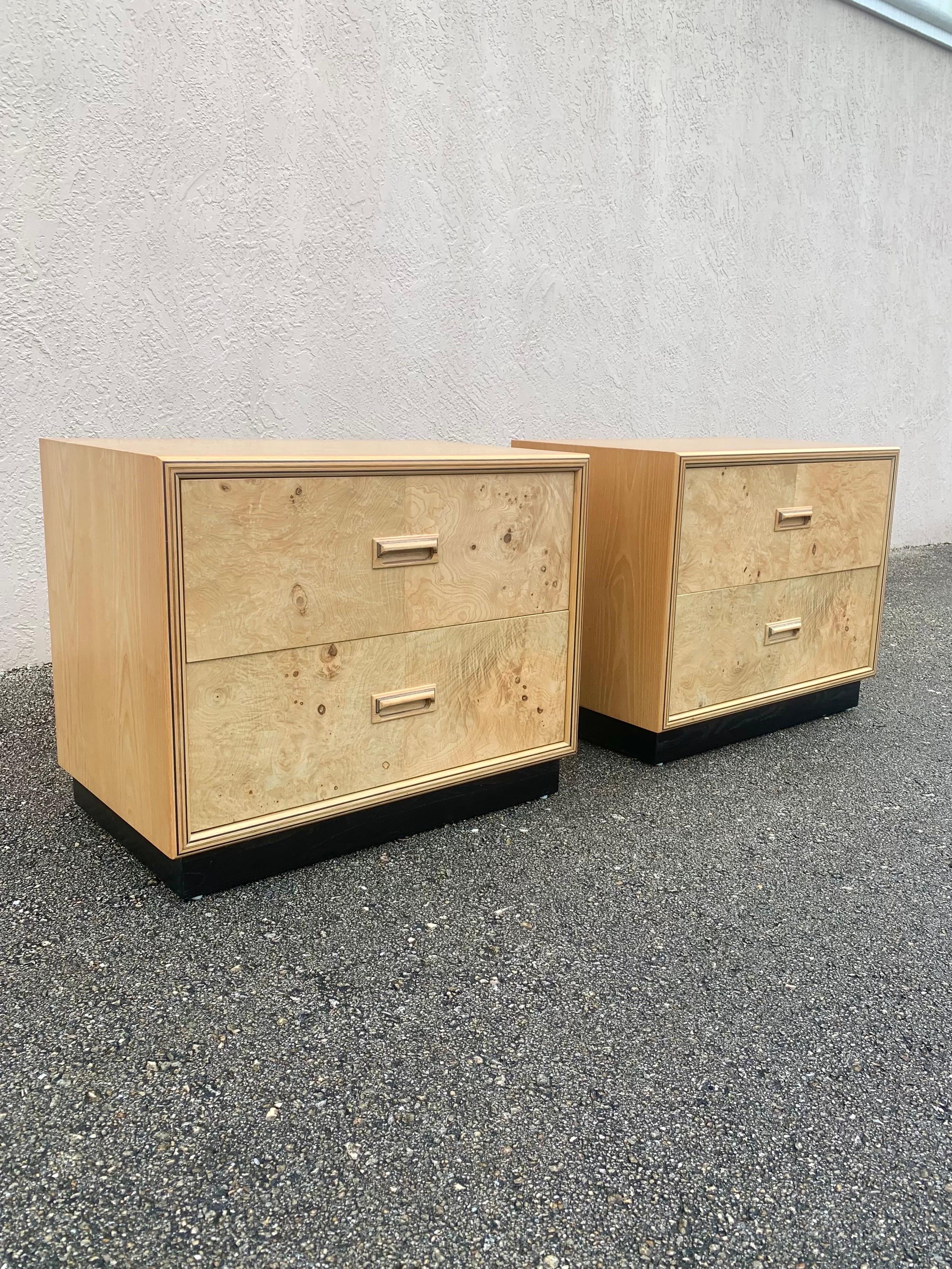 Exceptional pair of nightstands by Henredon for their Scene two line. 

Burped olive wood drawer fronts. Ebonized and ash wood studio made ply creating beautiful framing details. 

Ebonized plinth base. 

Made in the USA, circa 1980s. 

Design