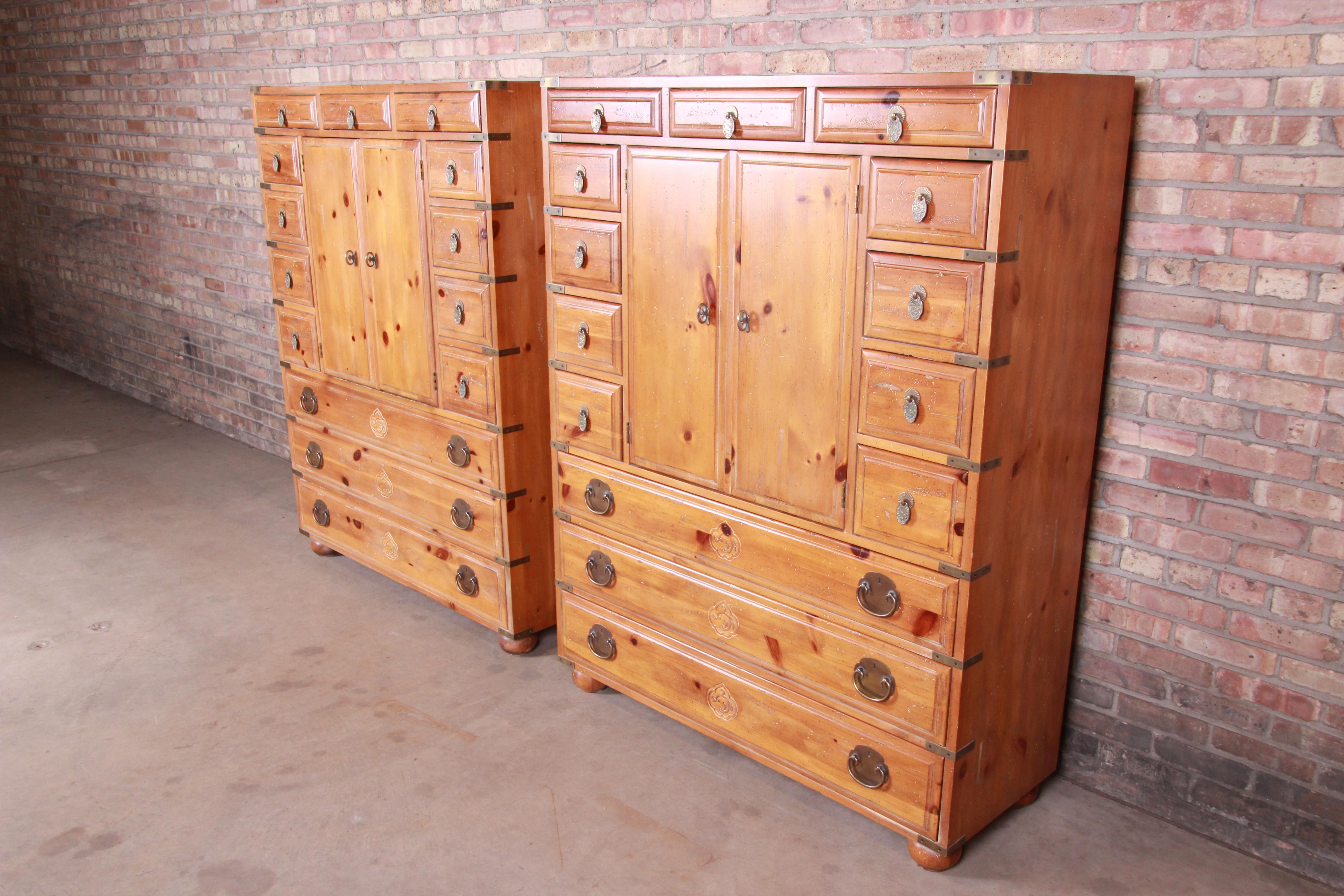 A gorgeous pair of 14-drawer Japanese tansu dresser chests

By Henredon Furniture

USA, circa 1970s

Solid carved pine, with original Asian-inspired brass hardware.

Measures: 48