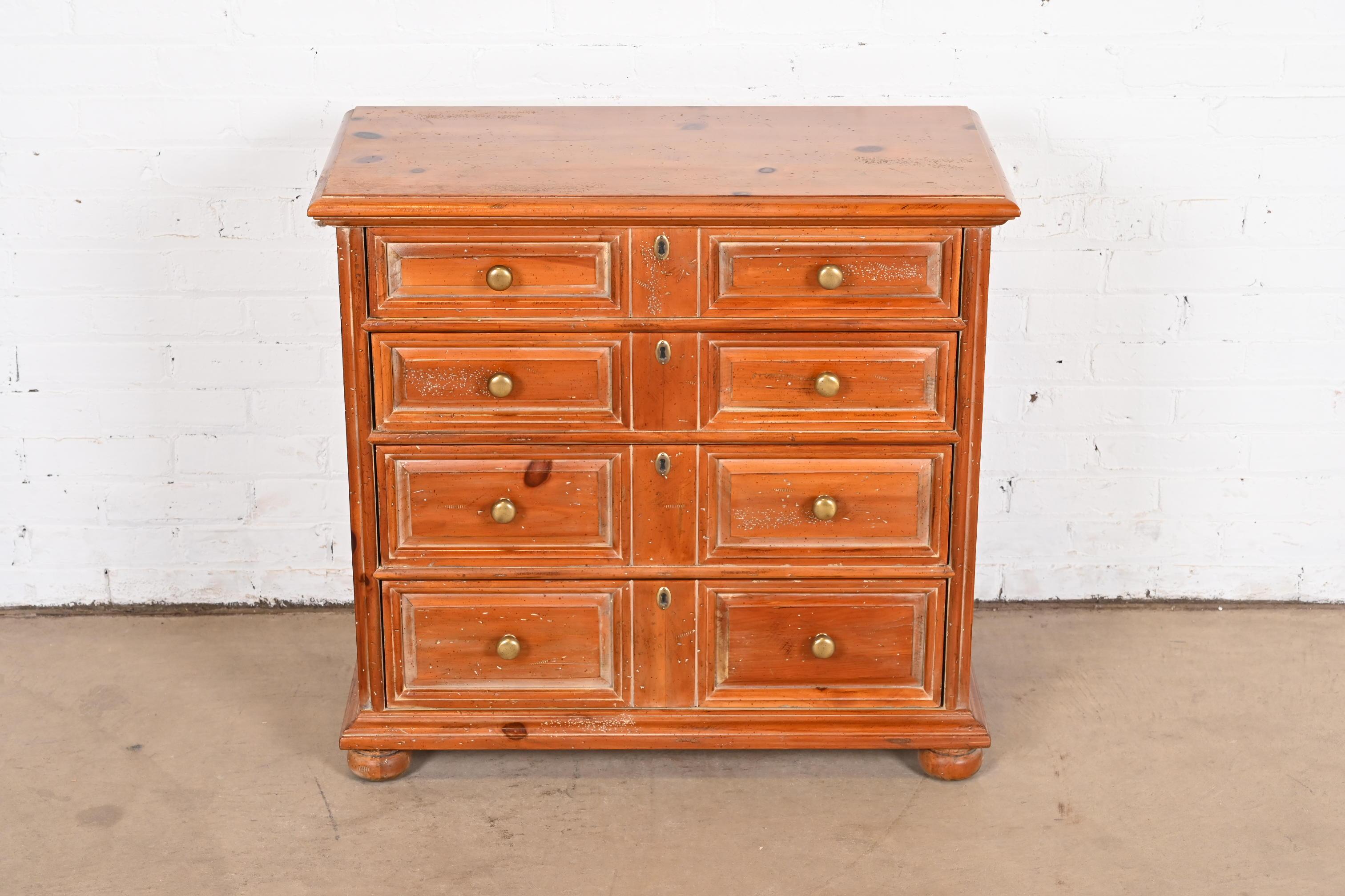 A gorgeous Spanish Colonial style commode or chest of drawers

By Henredon

USA, Late 20th Century

Carved solid pine, with brass hardware.

Measures: 32