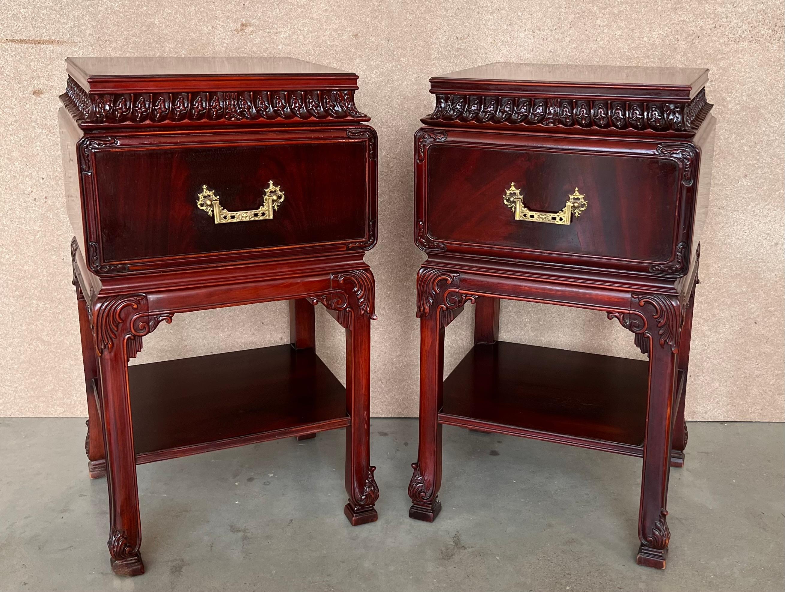 A pair of Henredon style Chinese chippendale carved mahogany chests in mahogany, fitted with etched brass oriental hardware. Exceptional workmanship with classic east Asian joinery and cabinetry, built to last for generations. Going with tradition