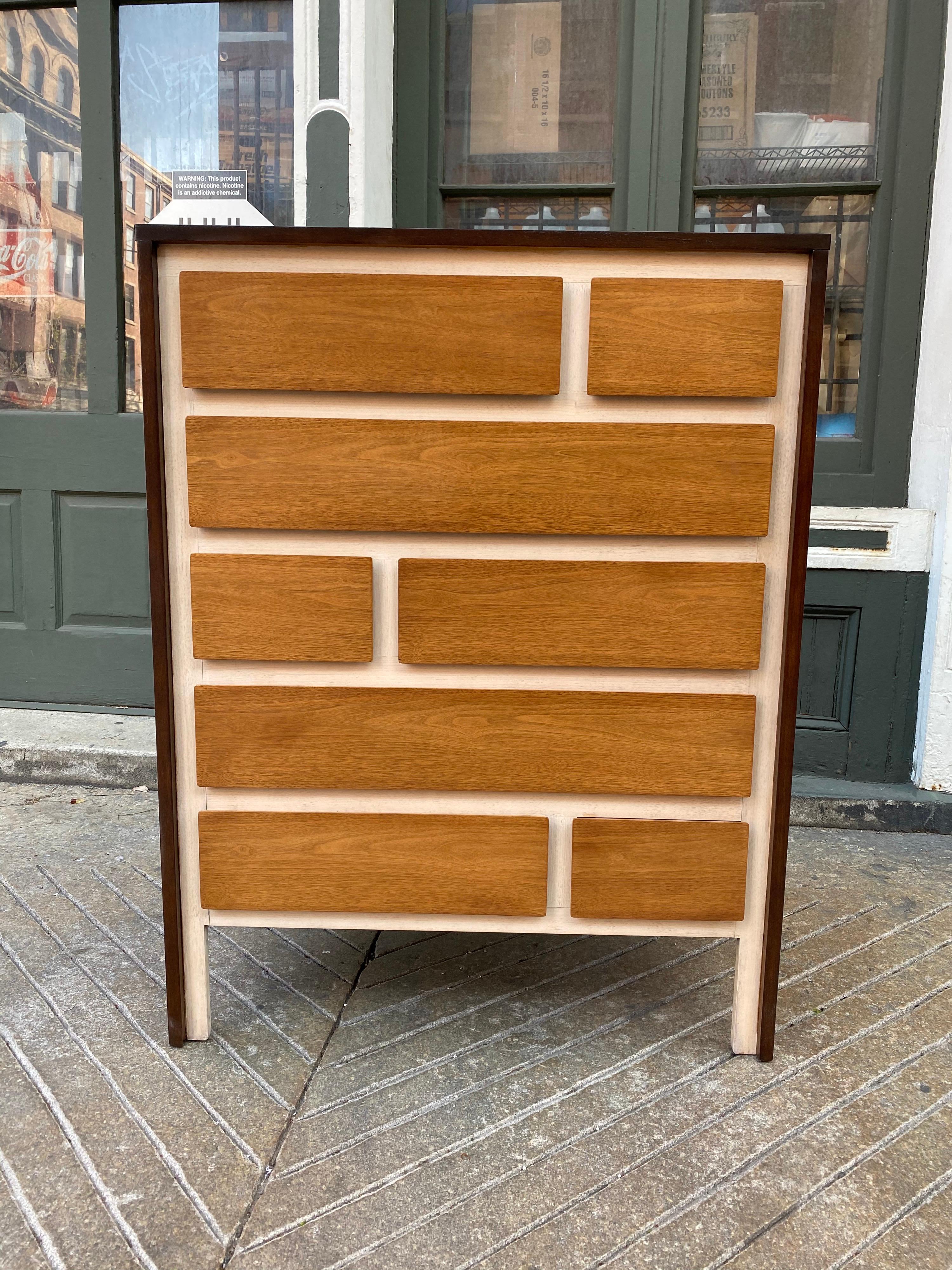Henredon High Boy dresser in the style of Gio Ponti. Ponti designed a bedroom set for the Singer Furniture Company in 1958. This Set is inspired by that design probably from the early 1960's. Outer cabinet is dark walnut, light walnut drawer fronts