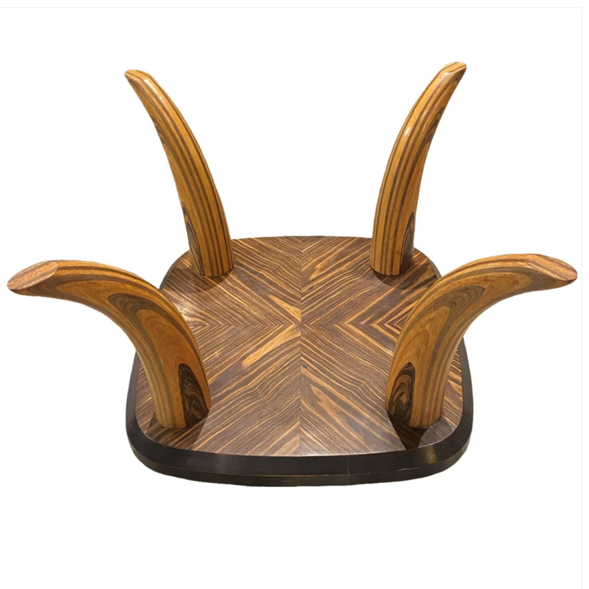 Henredon

Zebra Wood Faux Tusk Coffee Table

c. 1970

Overall Dimensions with Glass:

     Height: 16.5