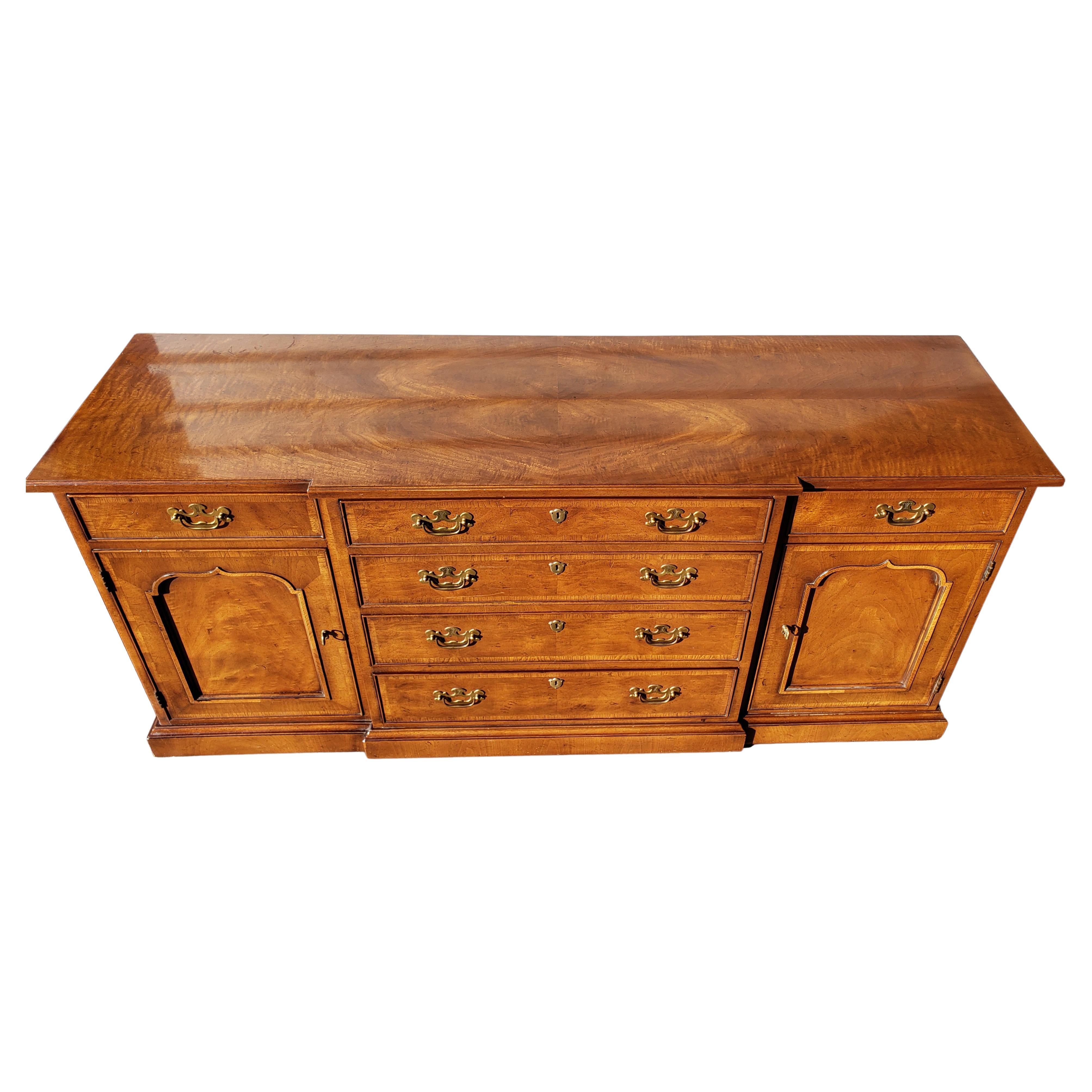 Henredon's 18th century Portfolio banded burl walnut credenza buffet. 
Burl walnut veneer. Banded front. On wheels for Easy handling. One shelf behind each door.
 All dovetailed drawers working flawlessly. Very good vintage condition with wear