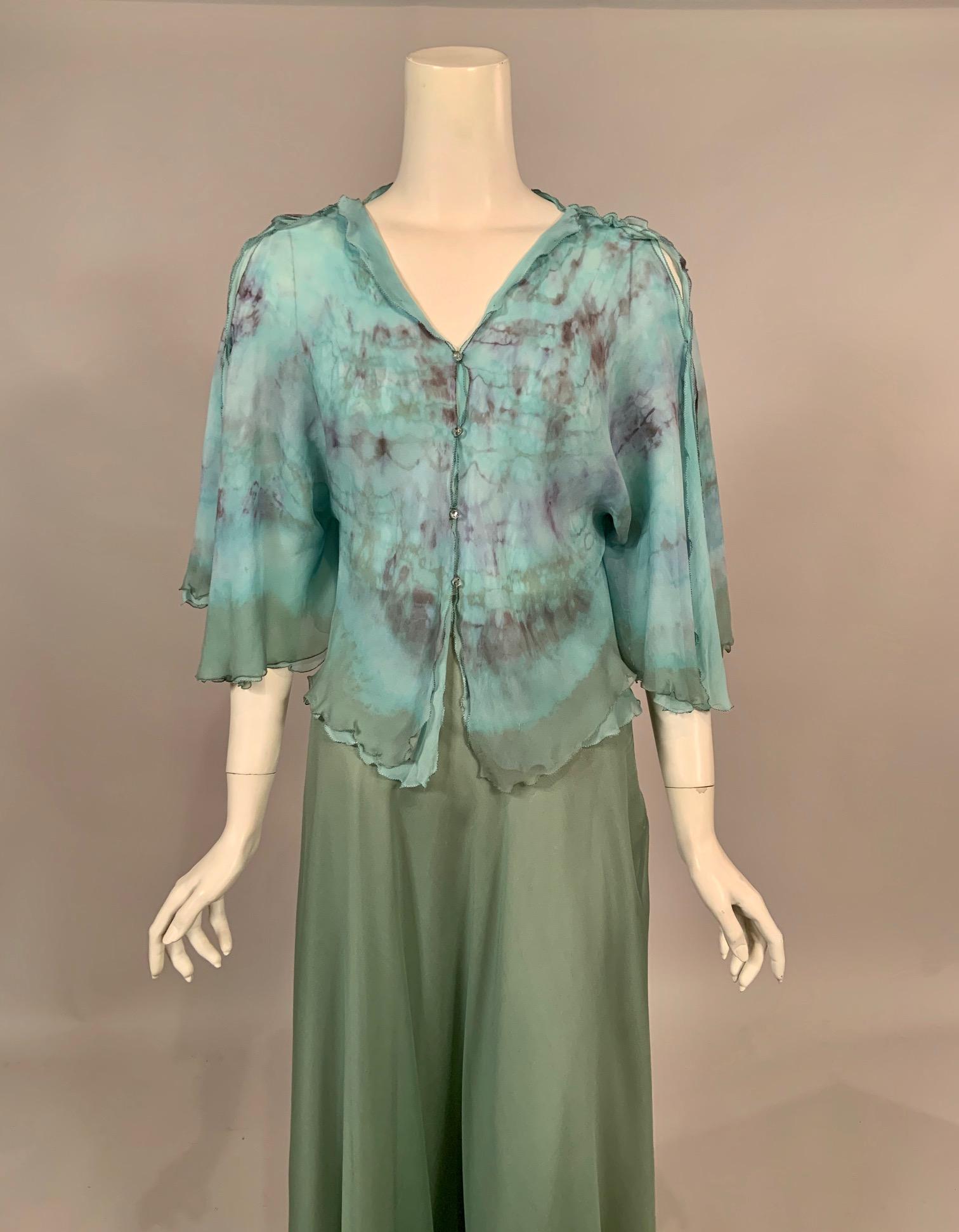 Made especially for Henri Bendel this two piece silk chiffon dress may have been inspired by the tie dye designs Halston was doing at this same time. The blouse is made from two layers of silk chiffon in a beautiful shade of blue. The top layer is