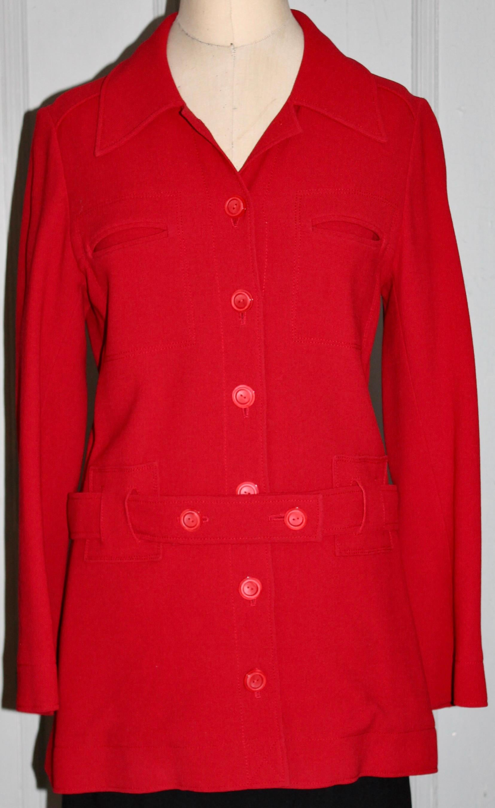 A Henri Bendel 'Limited Edition' classic red wool jacket buttons and belt in front.  No sizing label, approximately EU 40-42