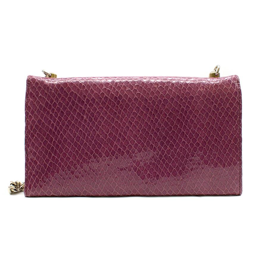 Henri Bendel Purple Crocodile-effect Clutch Bag
 
 - Purple crocodile-effect clutch bag
 - Detachable silver-tone chain strap
 - Front metal logo
 - Stud snap fastening
 - Internal mirror
 - Internal three slip pockets, two zipped pockets, six card