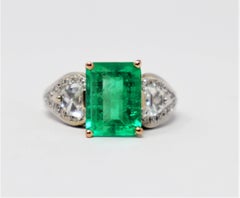 Henri Daussi 4.04 Carats Total Emerald Cut Emerald and Diamond Three Stone Ring