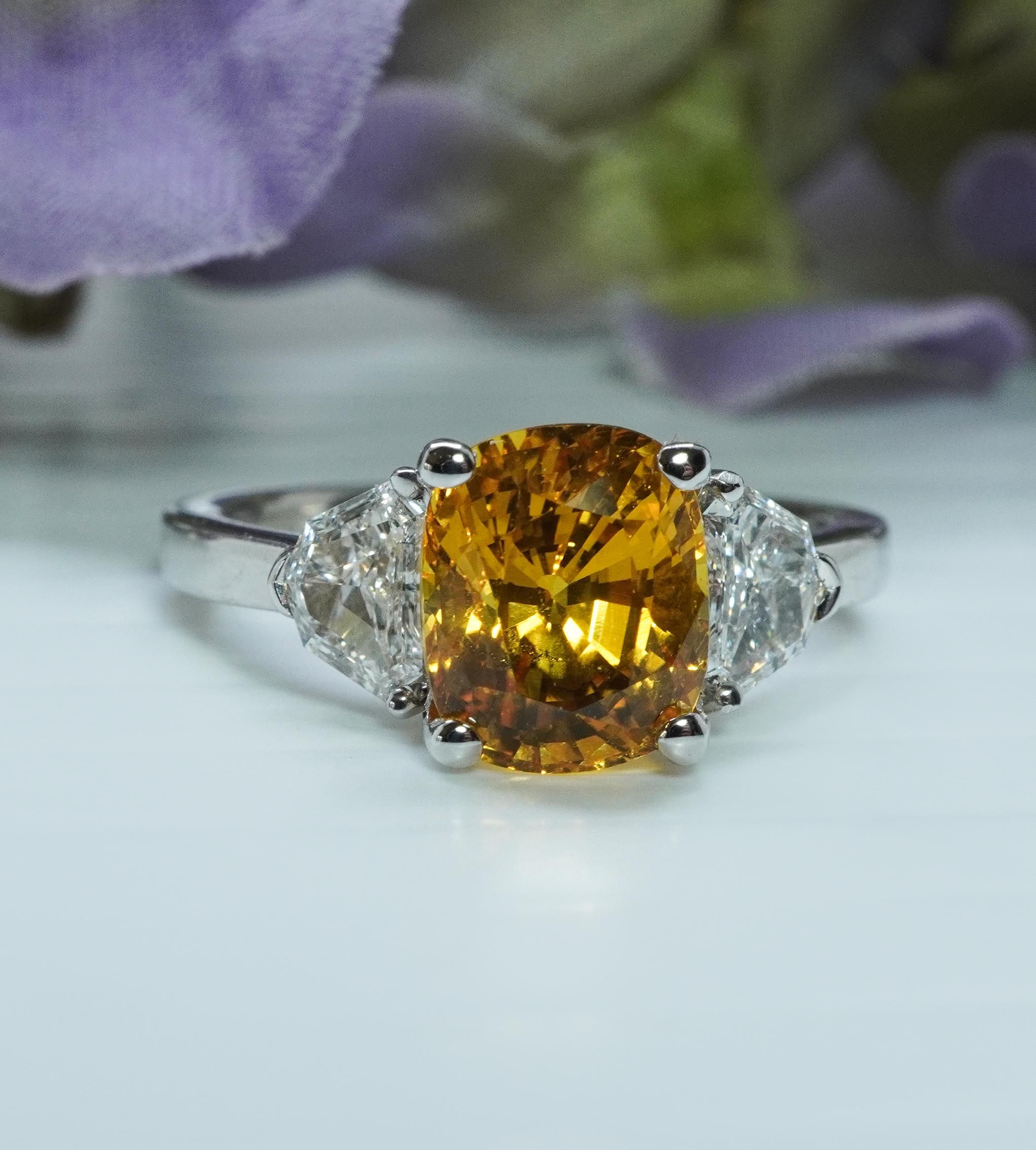   Henri Daussi 4.2ct Canary Yellow Cushion Sapphire Shield Diamond Ring 18K White Gold 3 stone

 This is a gorgeous piece by Henri Daussi crafted in 18K white gold. The mounting serial number is W418. According to Henri Daussi office the diamonds