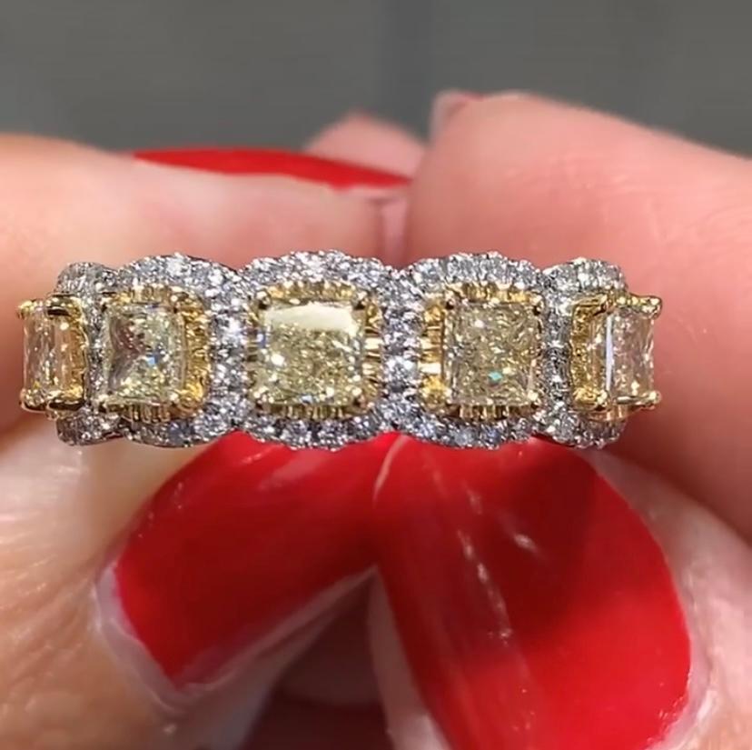 Five Stone Princess Cut Halo Ring
Metal: 18K White Gold
Diamond Shape: Canary Princess-cut Diamonds 
Diamond Details: 5 Princess - cut 1.11ct tw
Pave Set Halo Round Brilliant cuts 0.28ct tw
Diamond Details: Light Yellow Color - VS1