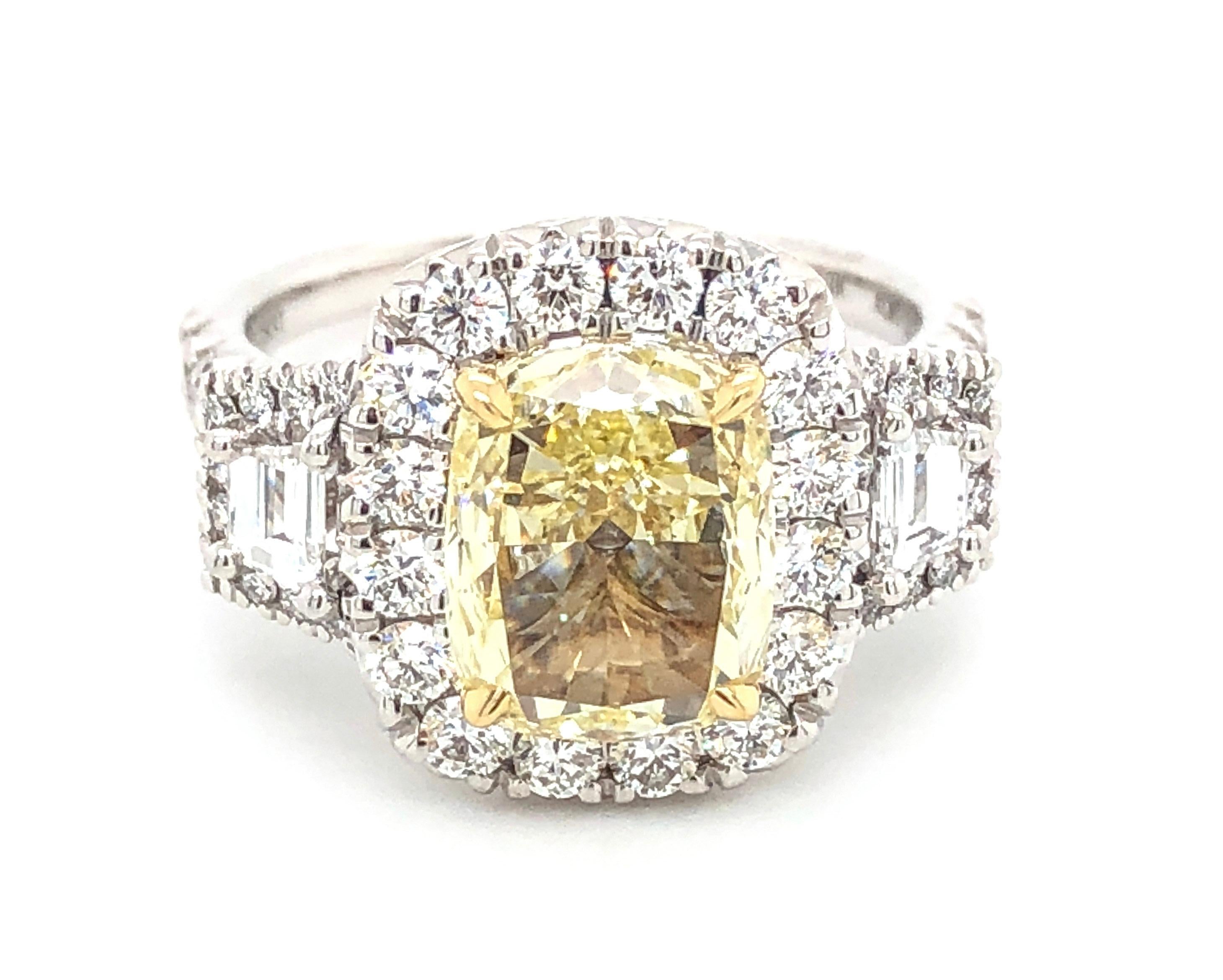 You will adore our Cushion Cut Three Stone Canary Fancy Yellow Center Diamond Ring because of its fantastic sparkle and shine! Even more, sparkle is added by pave set of round diamonds around each diamond. With a total 3.31ct t.w. of sparkle we