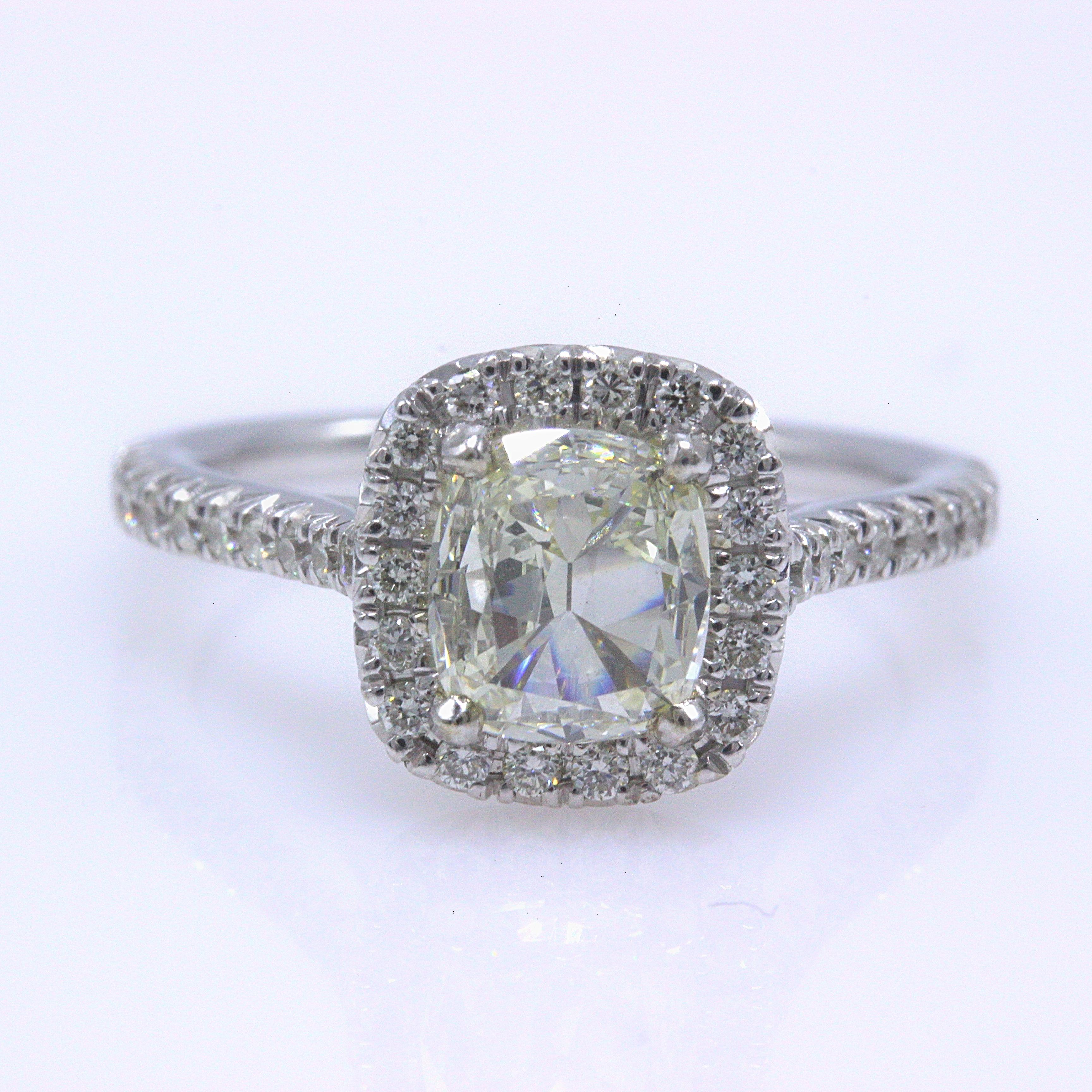 HENRI DAUSSI

Style:  Halo Diamond Engagement Ring with Diamond Band
Metal:  14K White Gold
Size:  4.25 - Sizable
Total Carat Weight:  1.13 TCW
Diamond Shape:  Cushion Cut Diamond 0.80 CTS 
Diamond Color & Clarity:  J / SI1
Accent Diamonds:  0.33