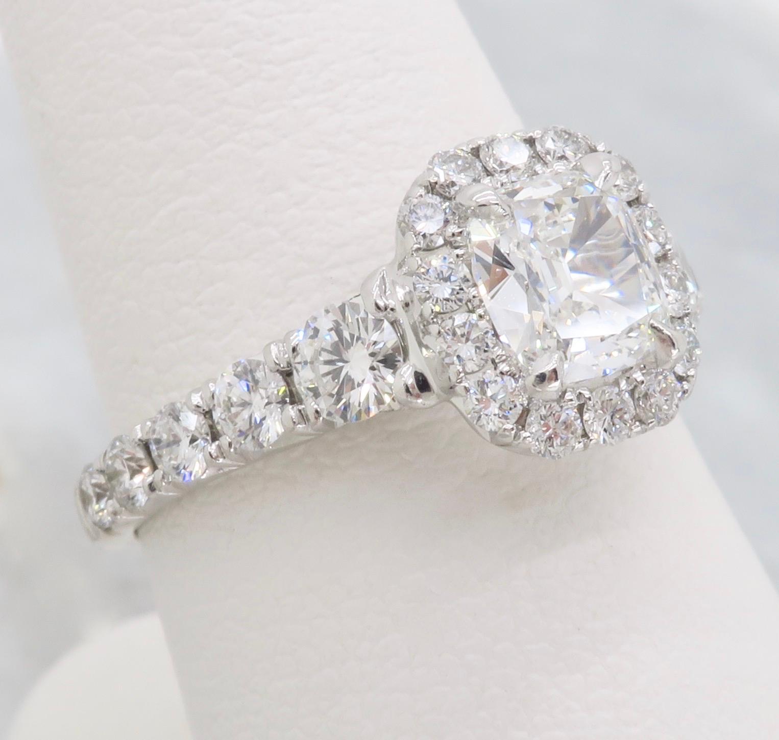 Henri Daussi Signature Cushion cut Diamond Halo Engagement Ring in 18K White Gold.

Center Diamond Carat Weight: .56CT
Center Diamond Cut: Cushion Modified “Daussi Cushion
