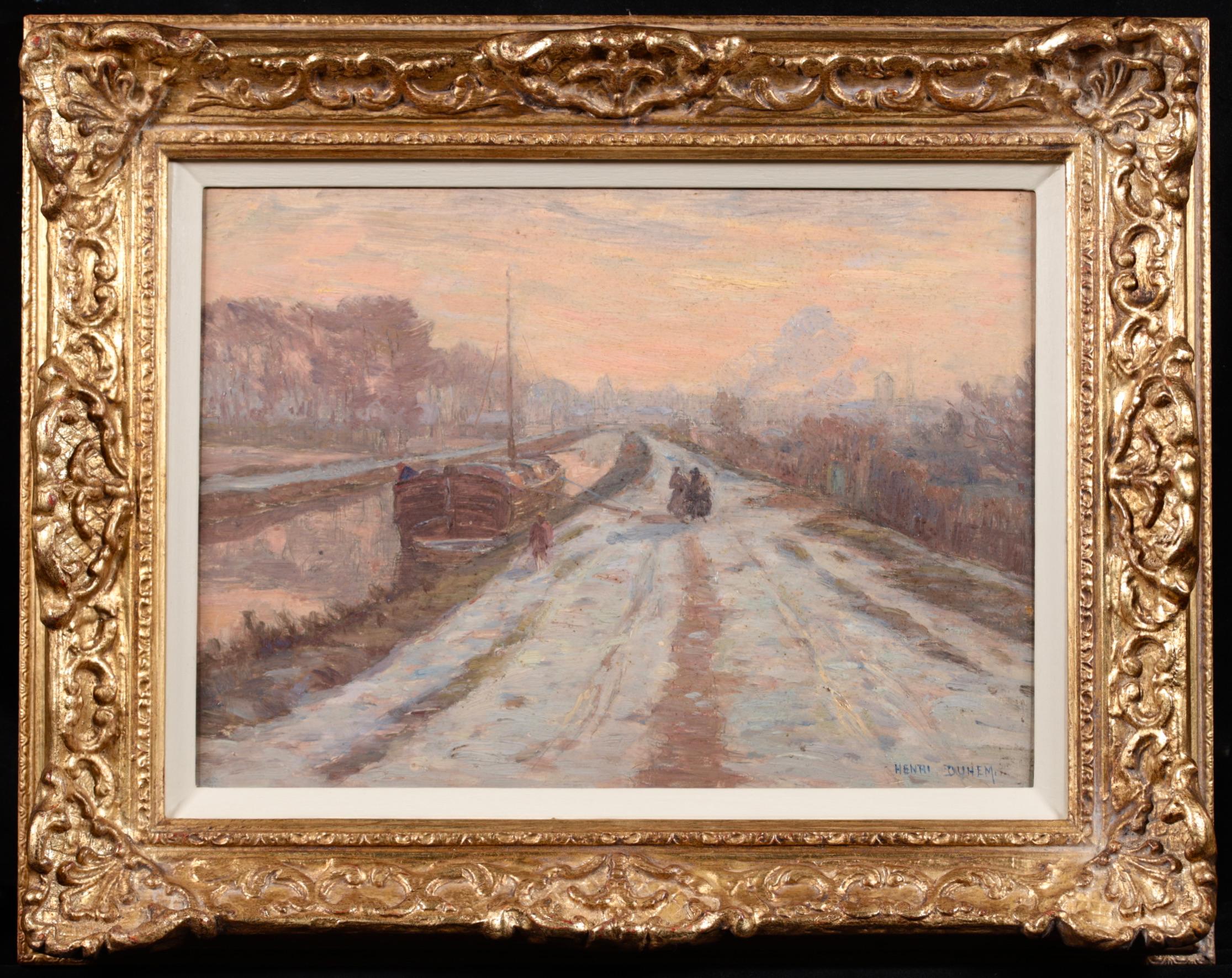 Signed and dated oil on panel winter landscape by French impressionist painter Henri Duhem. This beautiful piece depicts a view of figures on a snow-covered path beside a canal boat on the canal in Douai. The trees that line the canal are bare.
