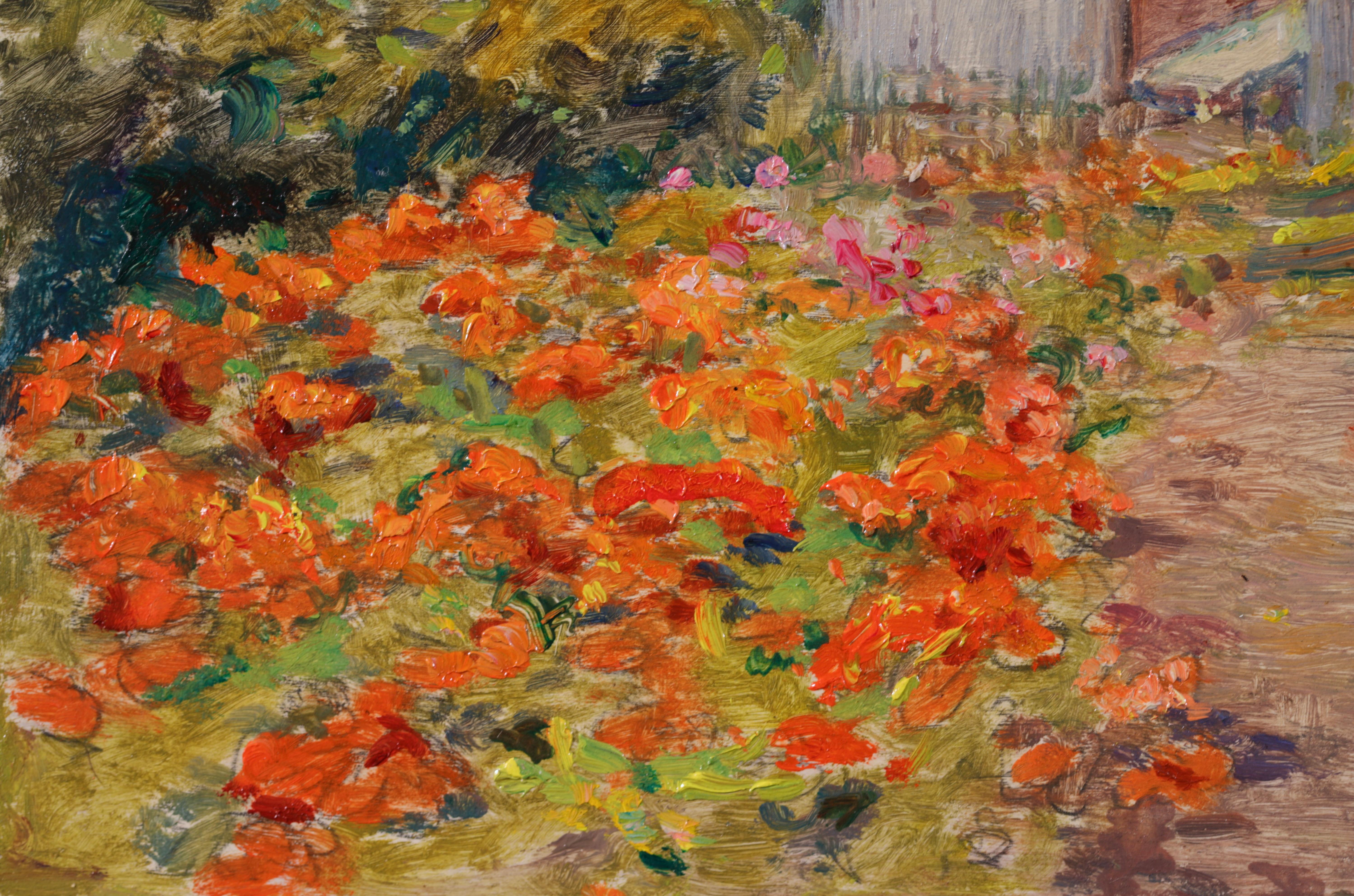 Signed and dated landscape oil on panel by French impressionist painter Henri Duhem. The painting depicts a view of the artist's garden of flowers, filled with orange, red and pink blooms. A path leads up to the buildings on the right and tall green