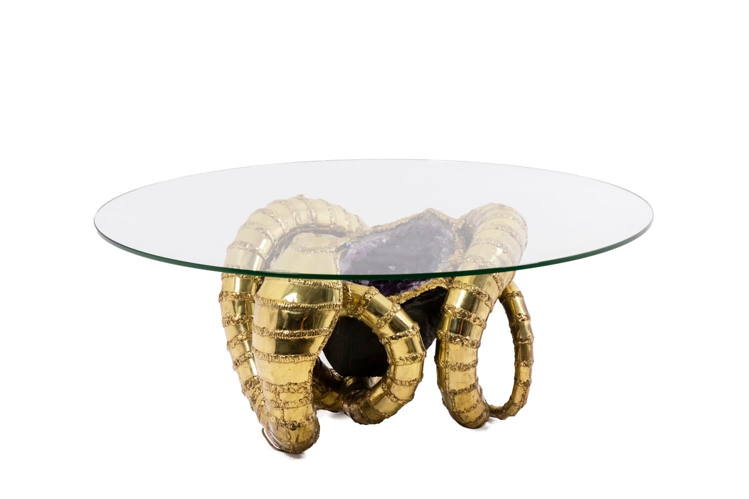 Coffee table “Cobra”, depicting a snake and presenting an amethyst in its center with a lighting system placed under its neck to illuminate the amethyst. Round glass top.
 