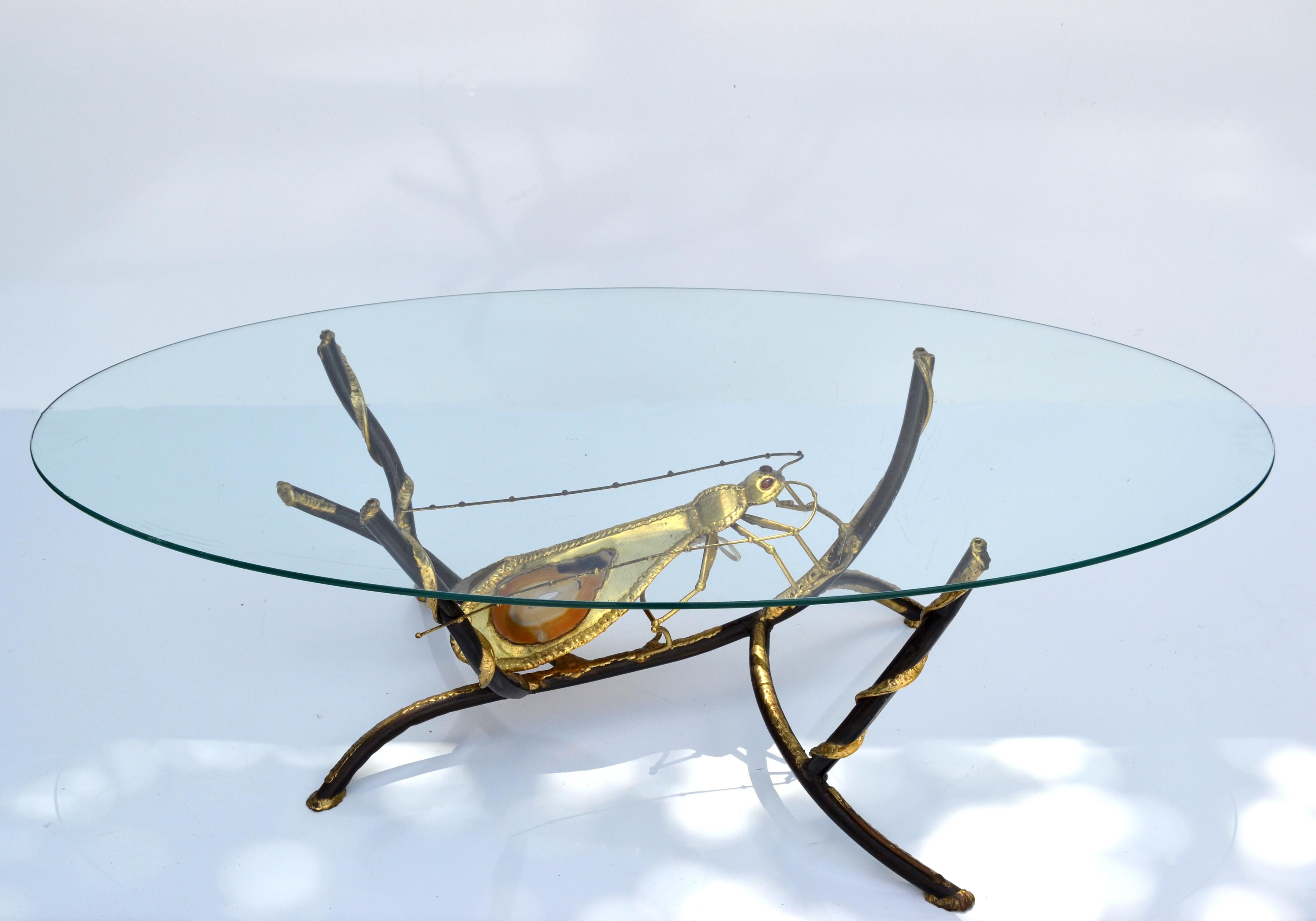 Atelier Duval-Brasseur signed Henri Fernandez illuminated grasshopper with two agates for an unusual elegant and rare coffee table complimented by a oval clear glass top.
Wired for US and in working condition takes 1 candelabra light bulb max. 60