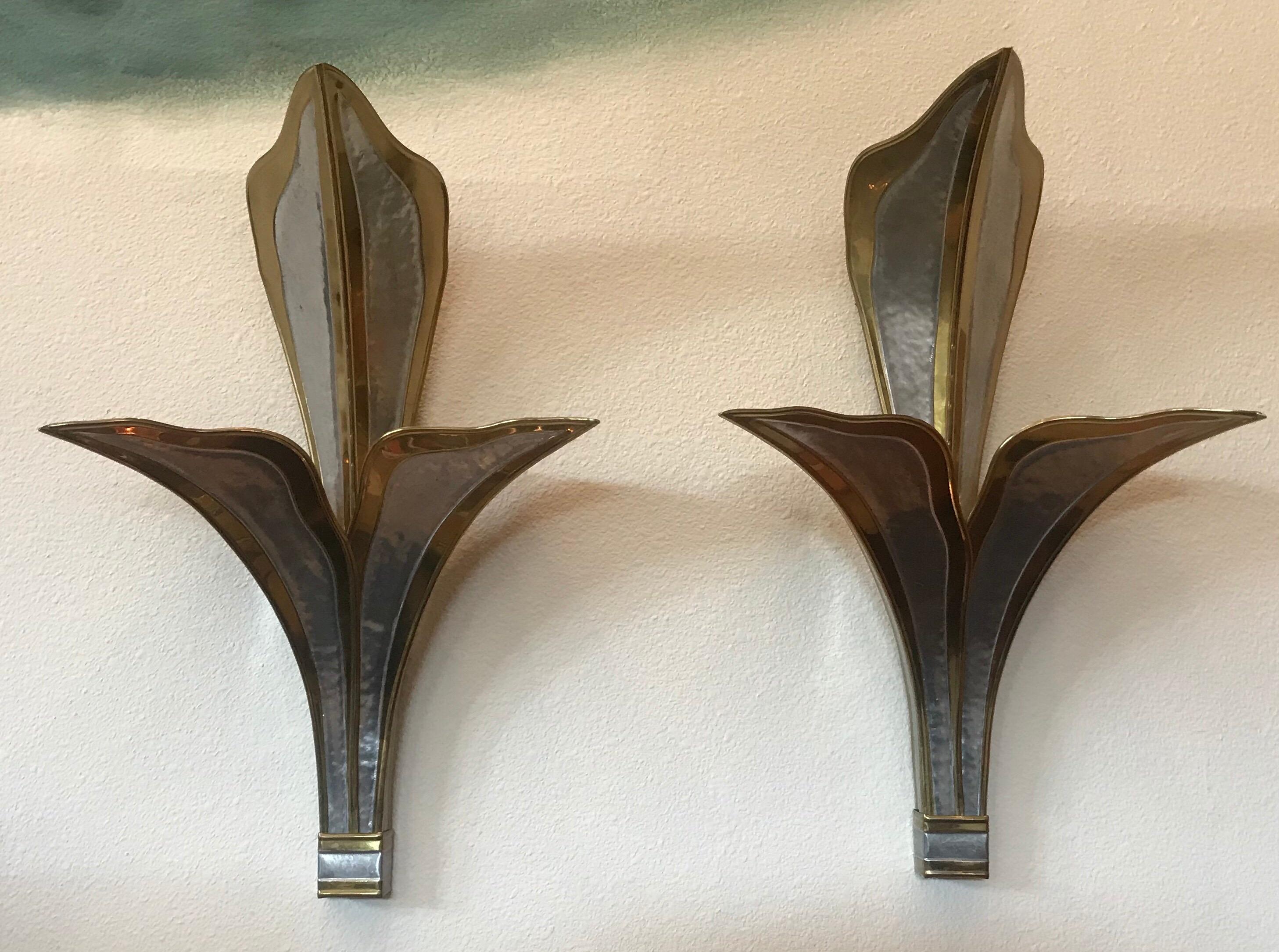 A wonderful pair of large handcrafted hammered brass and chrome wall lights by French designer Hendri Fernandez, 1980.
