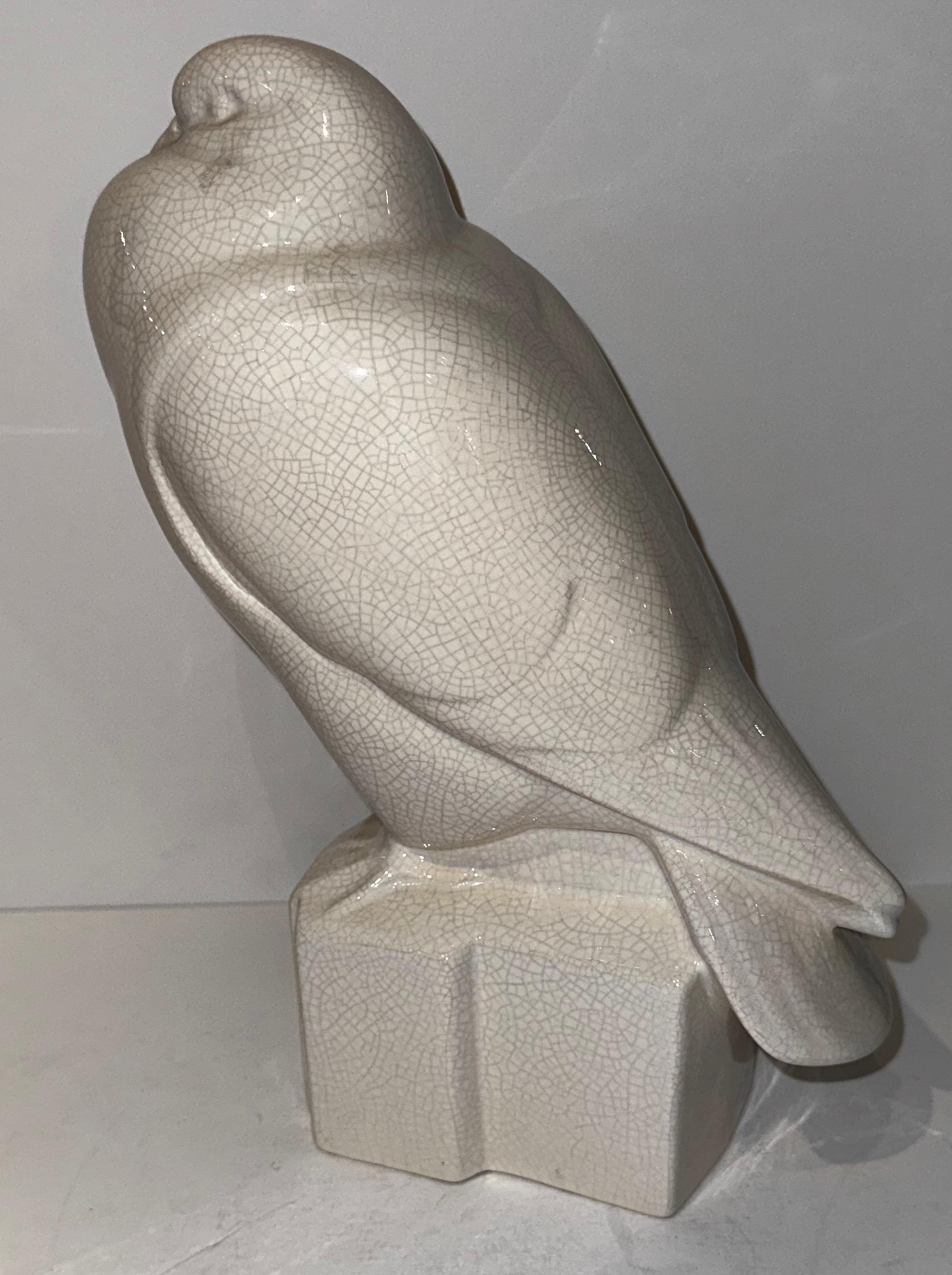 Henri Guingot Saint Clement France White Crackle Ceramic Dove, circa 1930s crackle glaze craqueles. This piece like many of the great ceramic series of animals. The white crackle ceramic dove made by Henri Guingot during the 1930s is an example of