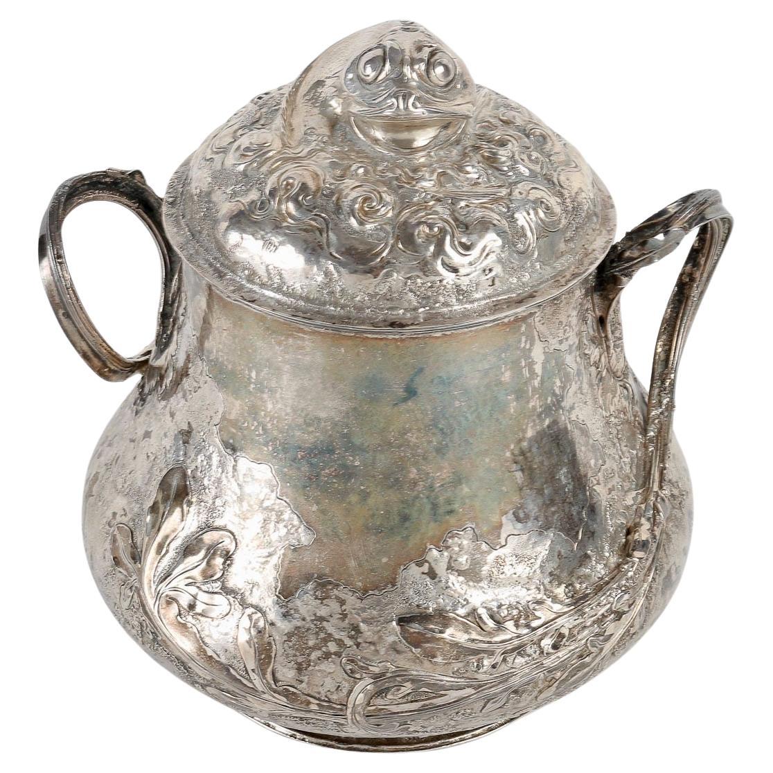 Henri HUSSON (1852 - 1914)
 An Art Nouveau naturalistic silver sugar covered pot with decoration in light relief, silver projections and algae over the entire surface, flanked by two vegetative handles.
Lid adorned with a fantastic fish emerging