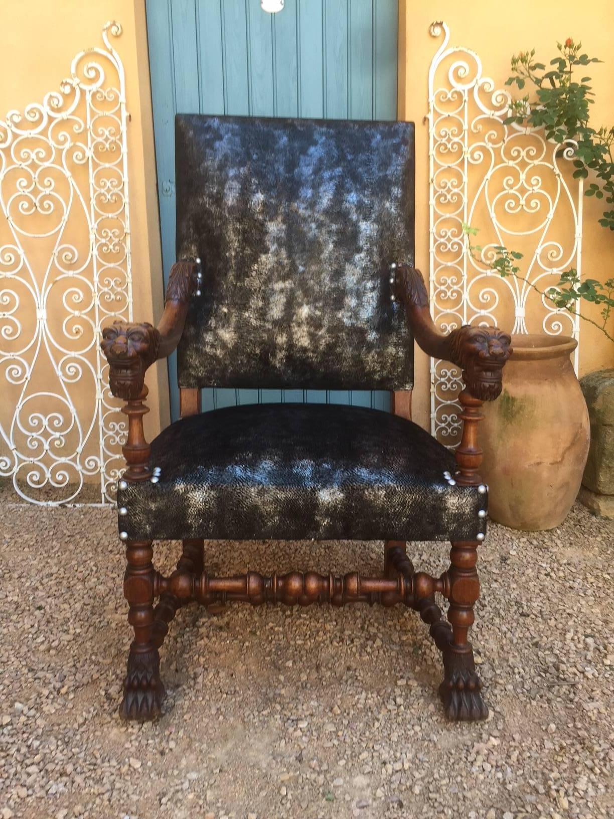 Very nice Henri II style armchair fully upholstered with a black and silver lizard skin imitation fabric. Napoleon III period. Lion's head armrest and lion's paw.