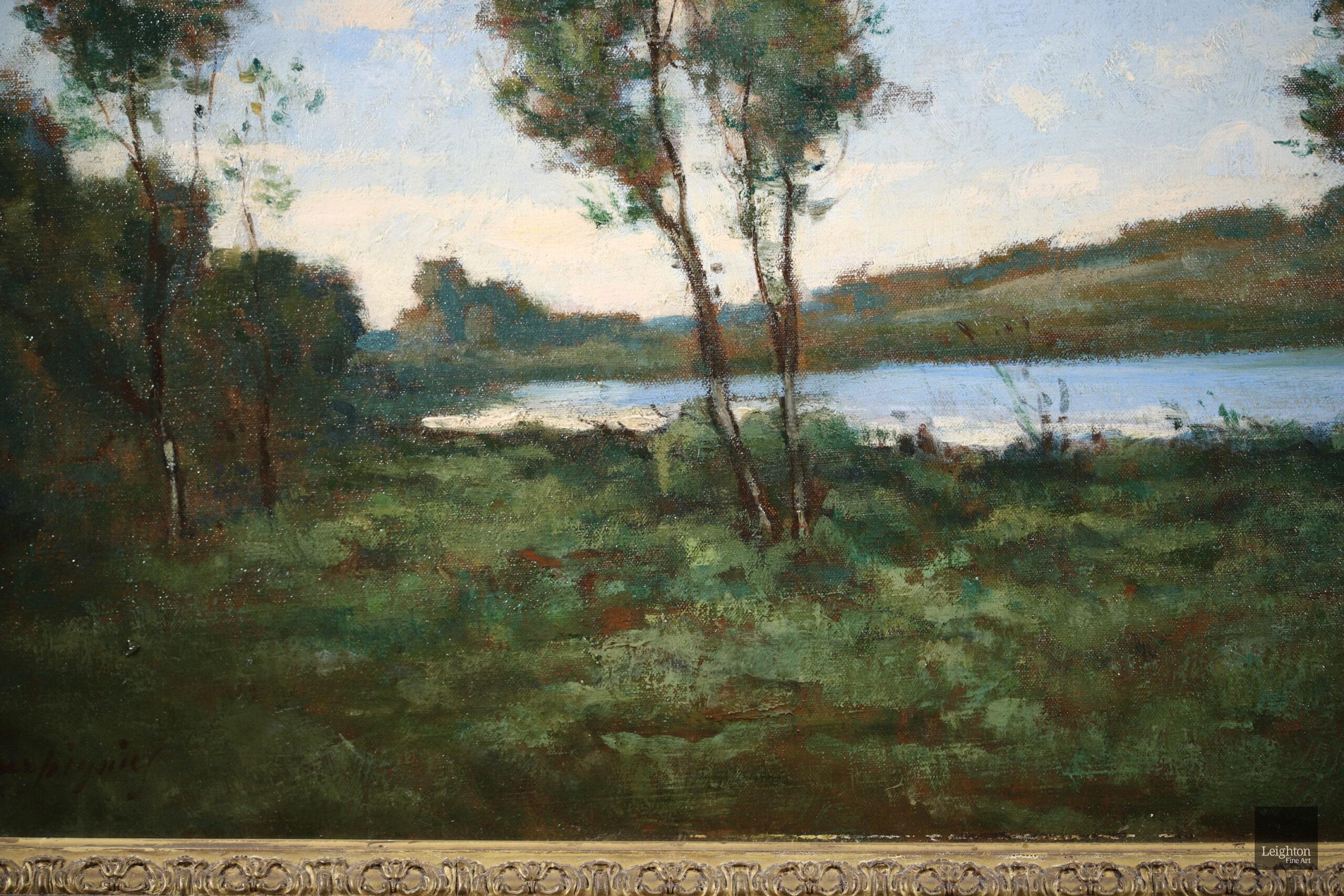 A superb large signed oil on canvas by the french Barbizon painter Henri Harpignies. This work depicts a landscape by the edge of a lake with Harpignies' signature tall birch trees prominent by the waters edge. The painting is in very good condition