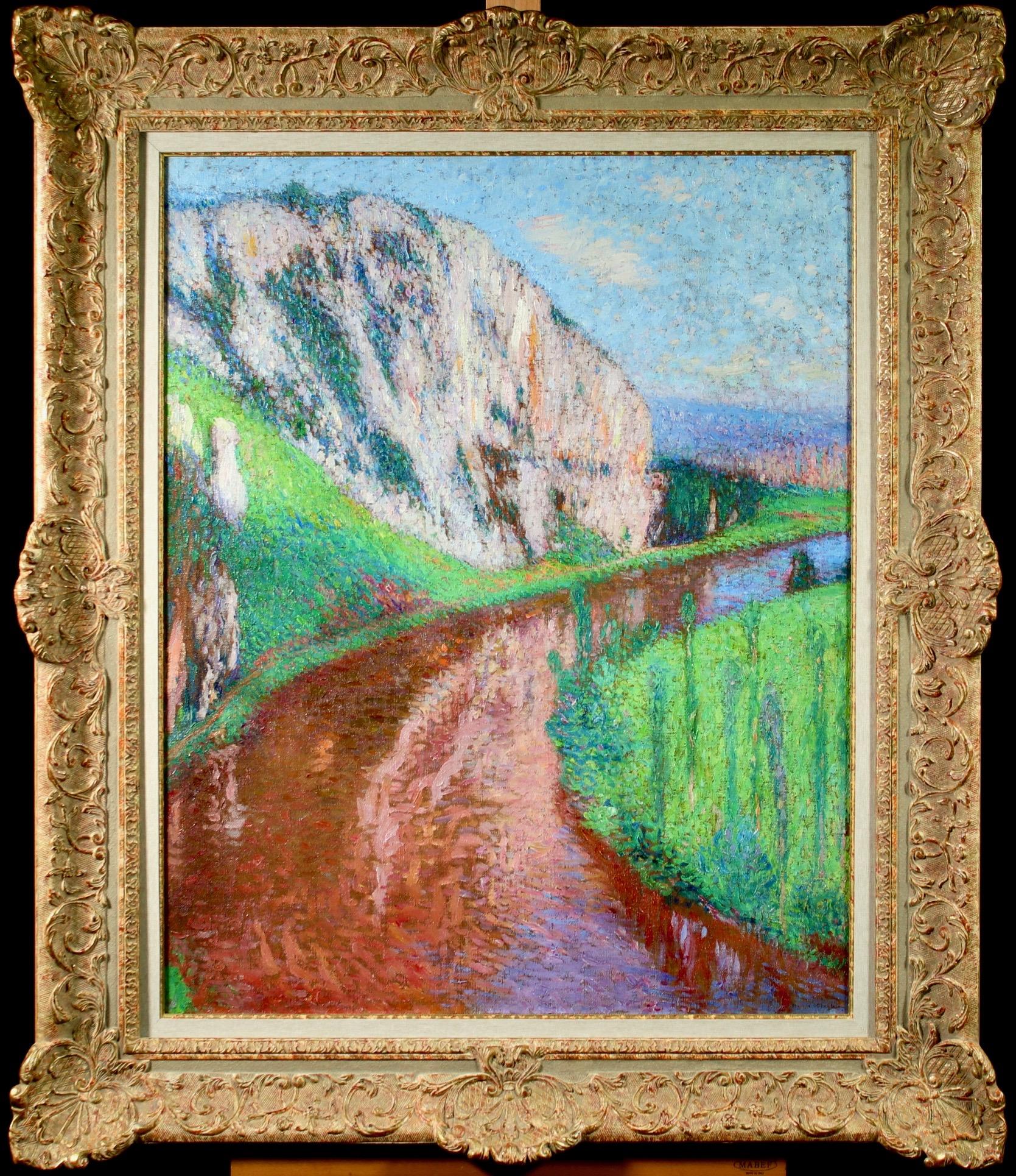 A breathtaking pointillist oil on canvas circa 1930 by Henri Martin depicting a landscape with a river flowing below the Cliffs of Saint Cirq Lapopie in South-West France. Signed lower right.

The authenticity of this work has been confirmed by