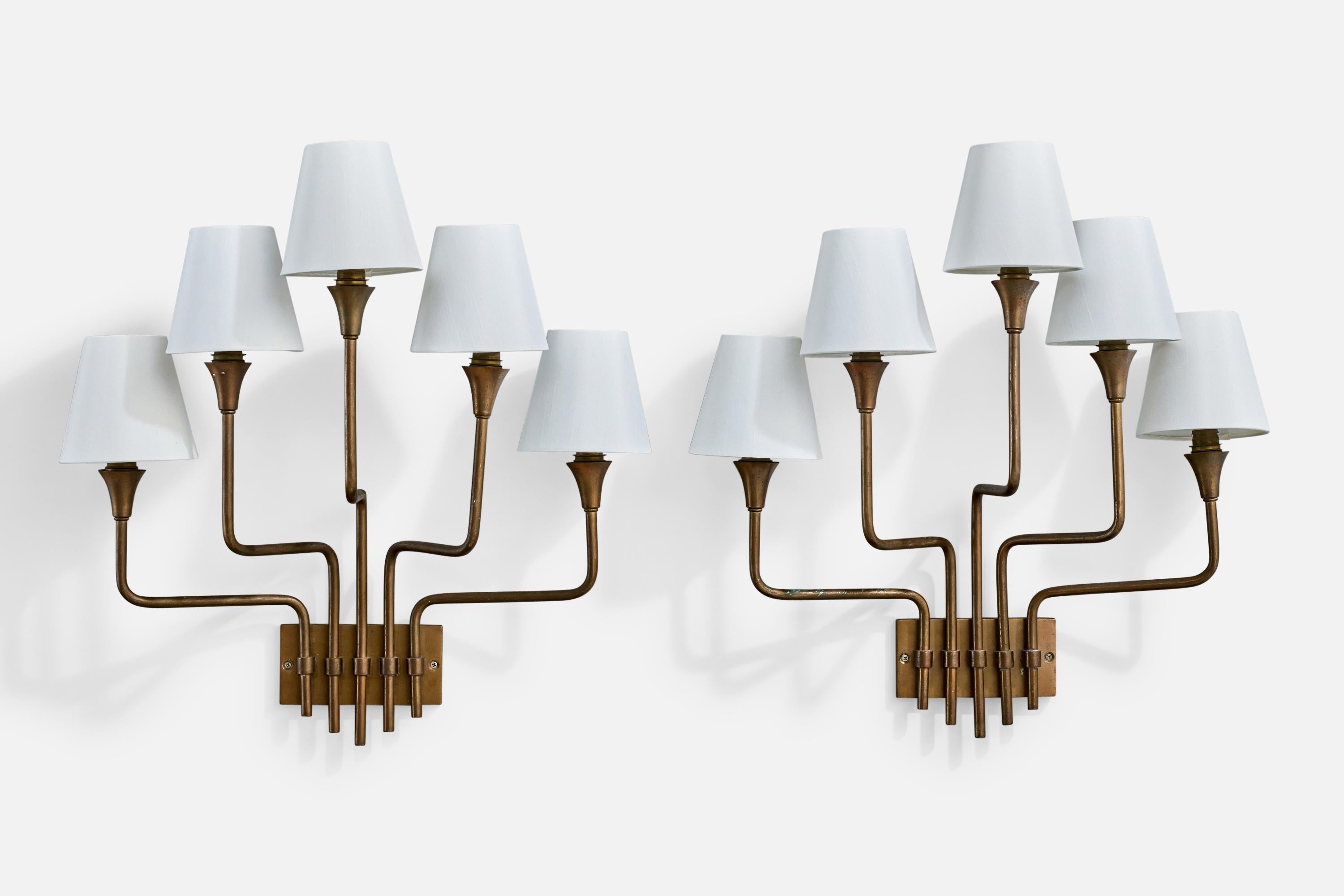 A pair of five-armed brass and white fabric wall lights designed and produced by Henri Petitot, France, c. 1950s.

Overall Dimensions (inches): 22