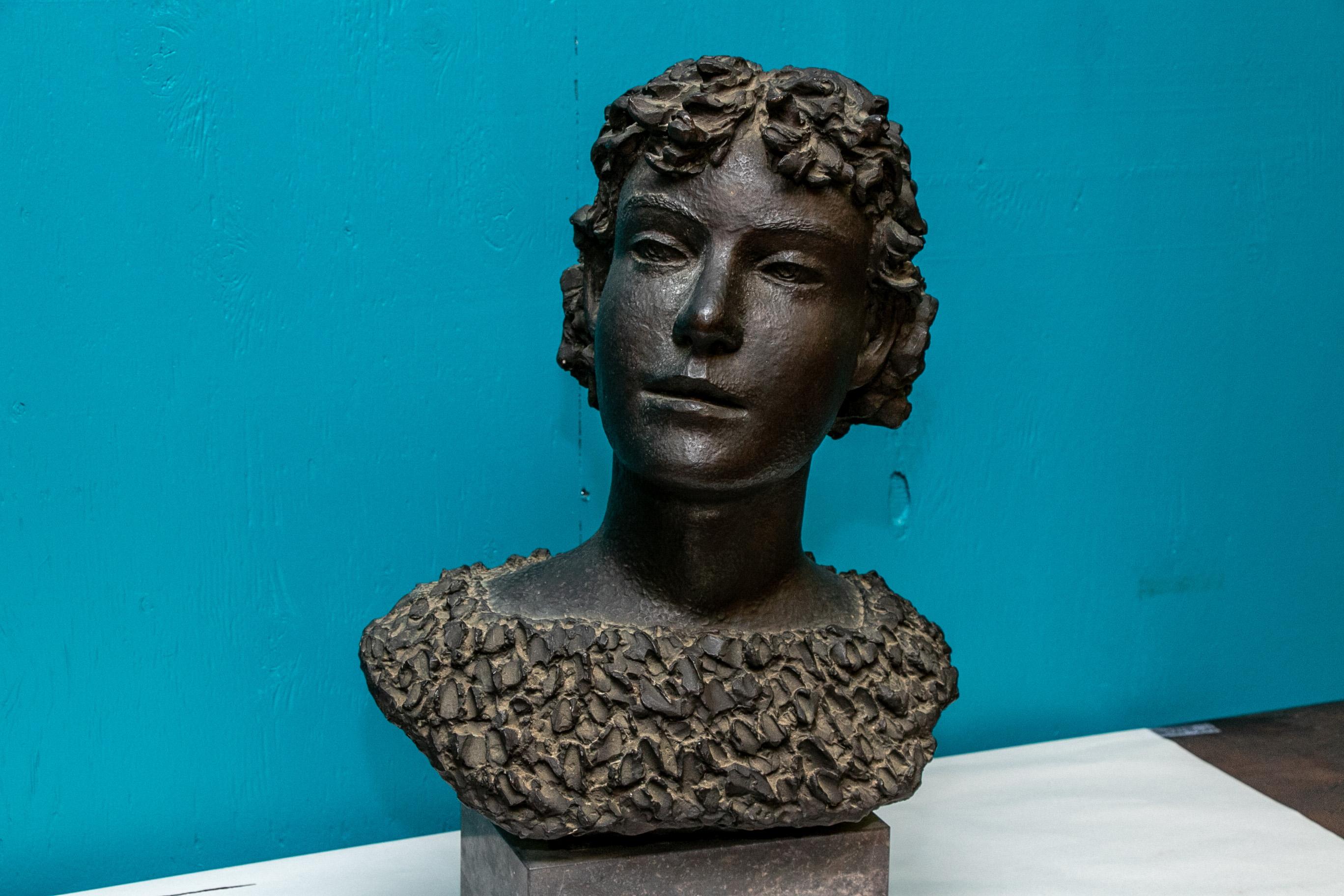 Henri Puvrez (Belgian, 1893-1971), signed patinated bronze female bust, signed and stamped 
