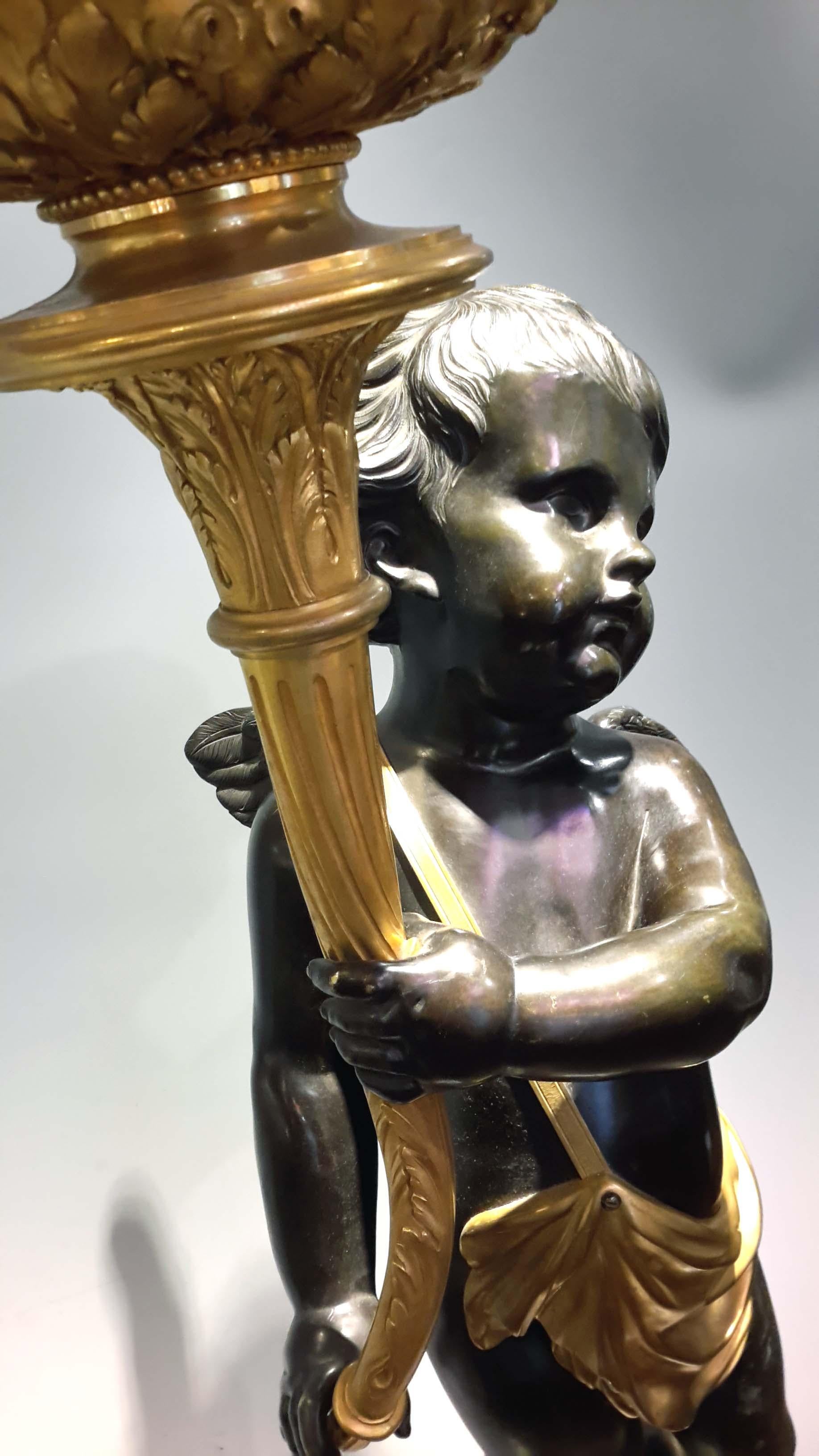 This monumental Henri Vian candelabra (gas lamp) is made from patinated and gilt bronze. The cherub is perched on an ormolu mounted marble pedestal, Stamped 