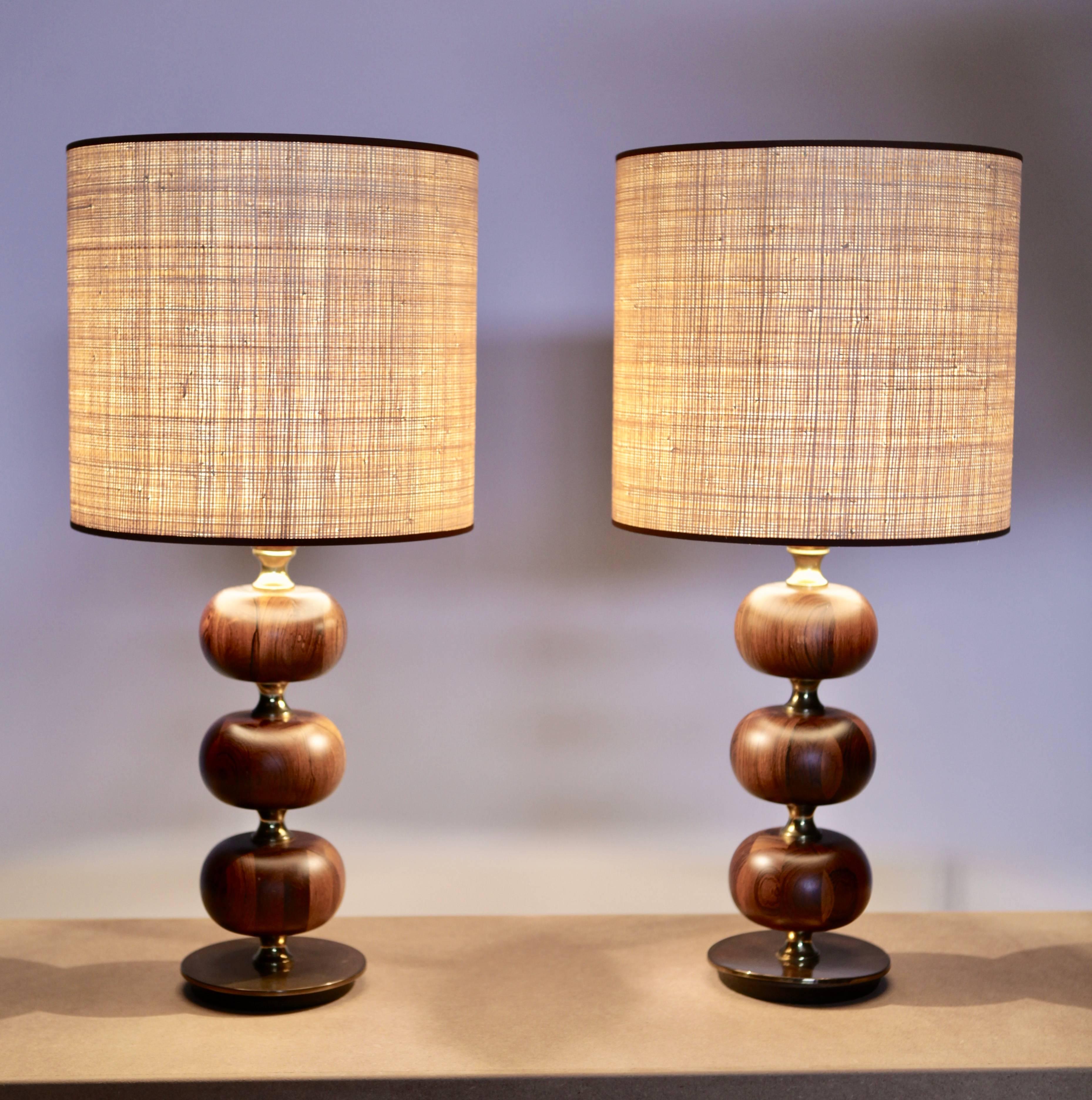 Excellent pair of table lamps in rosewood and brass, designed by Henrik Blomquist, and manufactured by Tranås Stilarmatur in Sweden the 1960s.
Handmade new Raffia Shades.