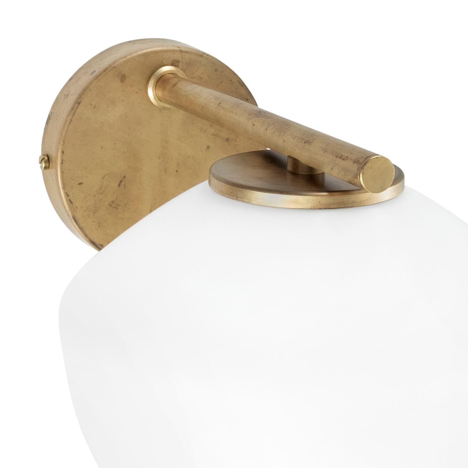 Wall lamp model DK designed by Henrik Tengler and manufactured by Konsthantverk.

The production of lamps, wall lights and floor lamps are manufactured using craftsman’s techniques with the same materials and techniques as the first