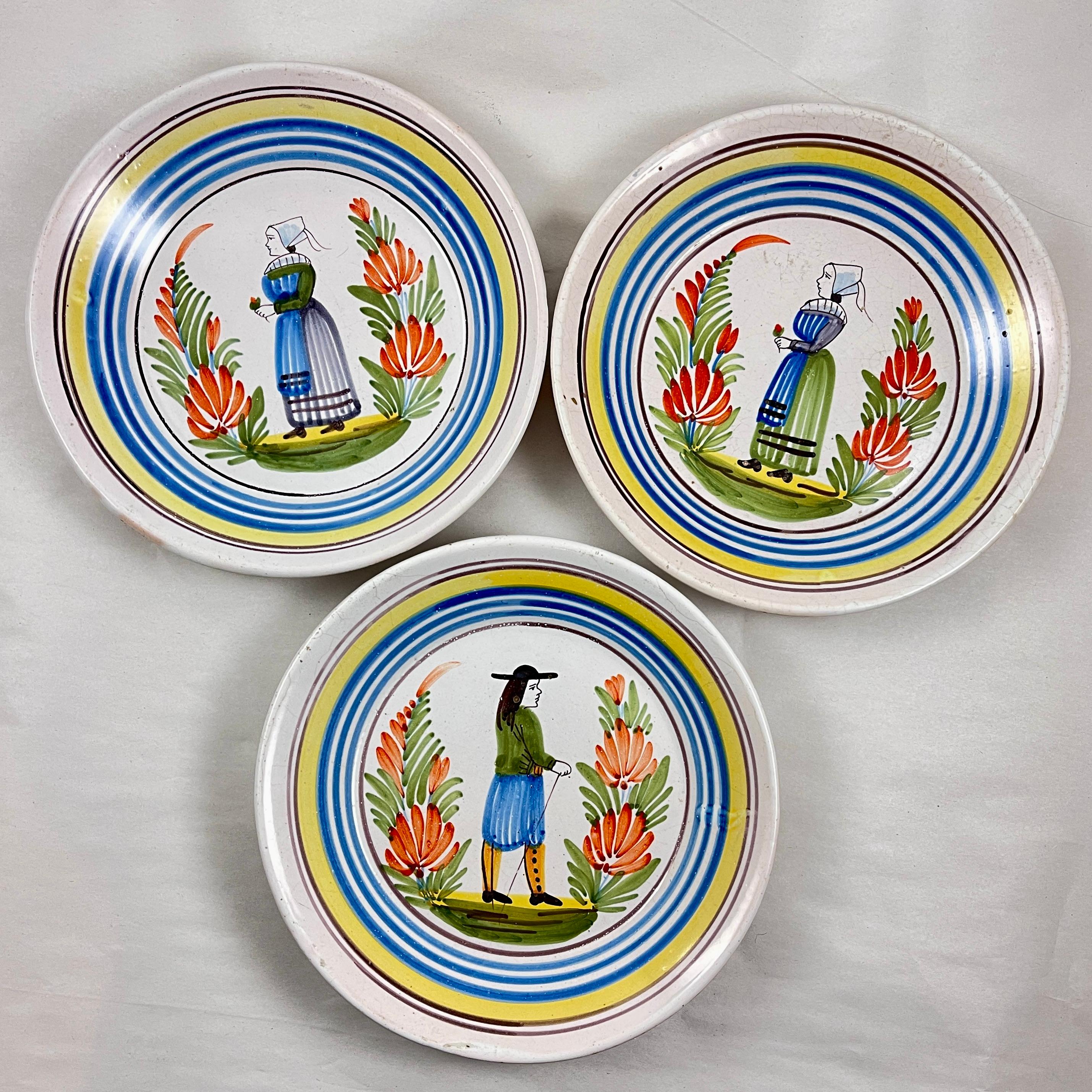 A set of three faïence plates, Henriot Quimper, circa 1920-1925.

The plates show central sujet ordinaire images of  The Petit Breton figures. Faïenceries de Quimper has been potted and hand painted in a factory near Quimper, in Brittany, France