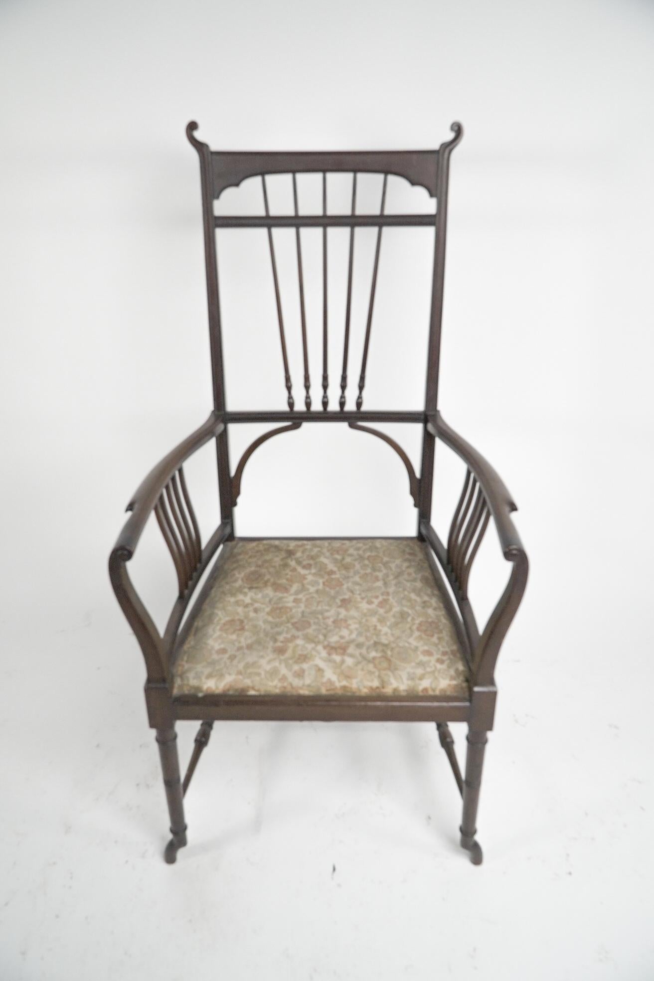 Henry W Batley attr. An Aesthetic Movement walnut armchair with sinuous touches. In Good Condition For Sale In London, GB